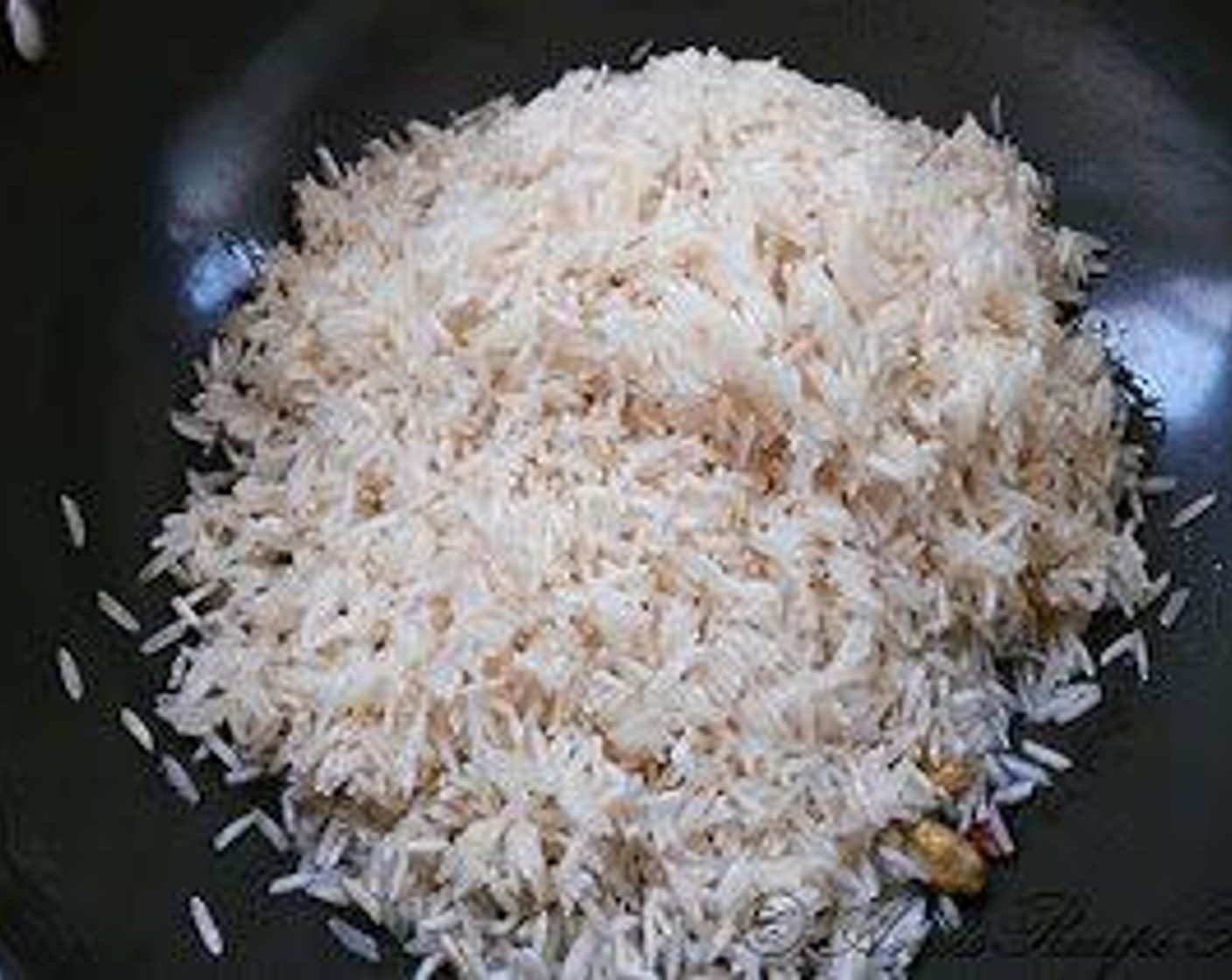 step 8 Add Basmati Rice (2 cups) and fry the rice for a good eight to ten minutes.