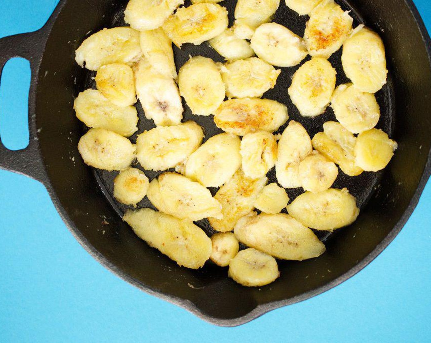 step 1 Heat Butter (1 Tbsp) over medium high heat in a cast iron skillet (if possible) or large frying pan. Add Bananas (3) and cook about three minutes on each side, until bananas begin to brown and caramelize. Remove from heat.