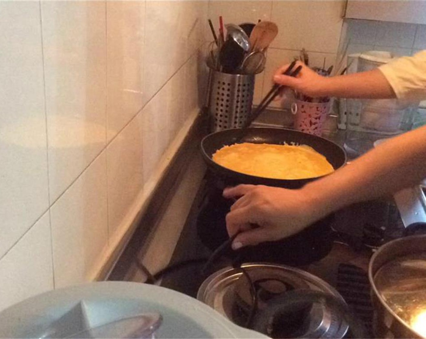 step 3 Beat all the Eggs (6) in a large bowl. Pour a fourth of the eggs into a pan over low-medium heat to make a egg pancake and remove. Repeat this  process until all the eggs are used.