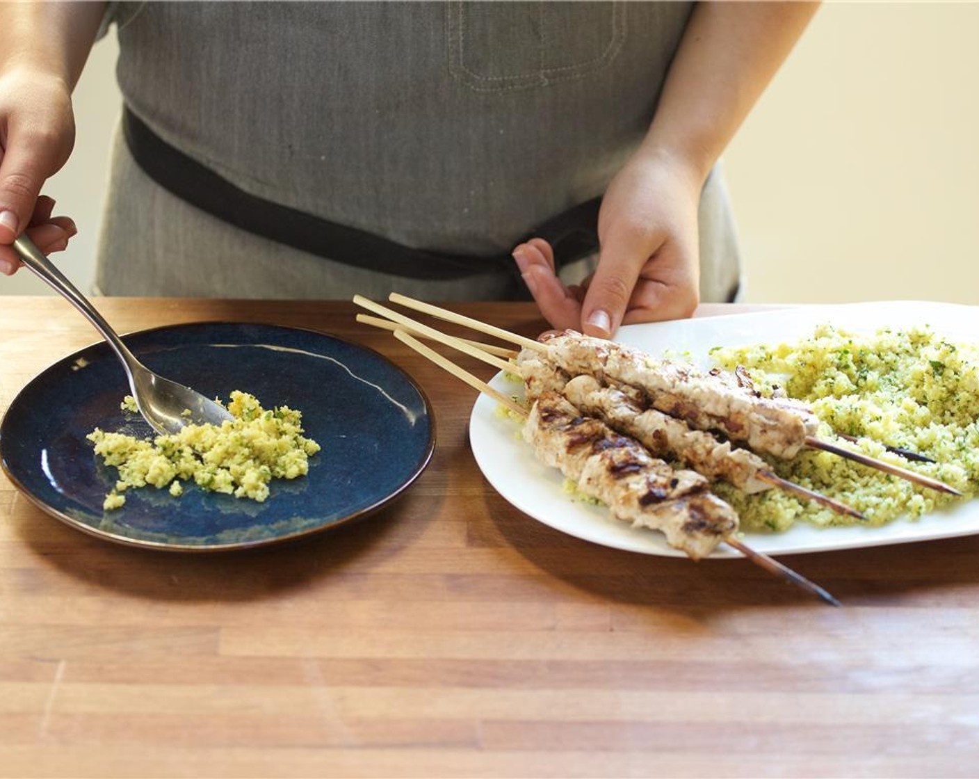 step 9 In the center of two plates place equal amounts of the the cauliflower tabbouleh. Top with the chicken skewers.