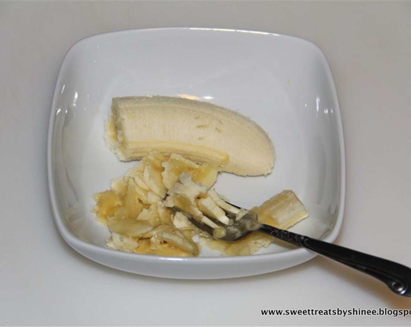 step 1 Mash Banana (1) with a fork.