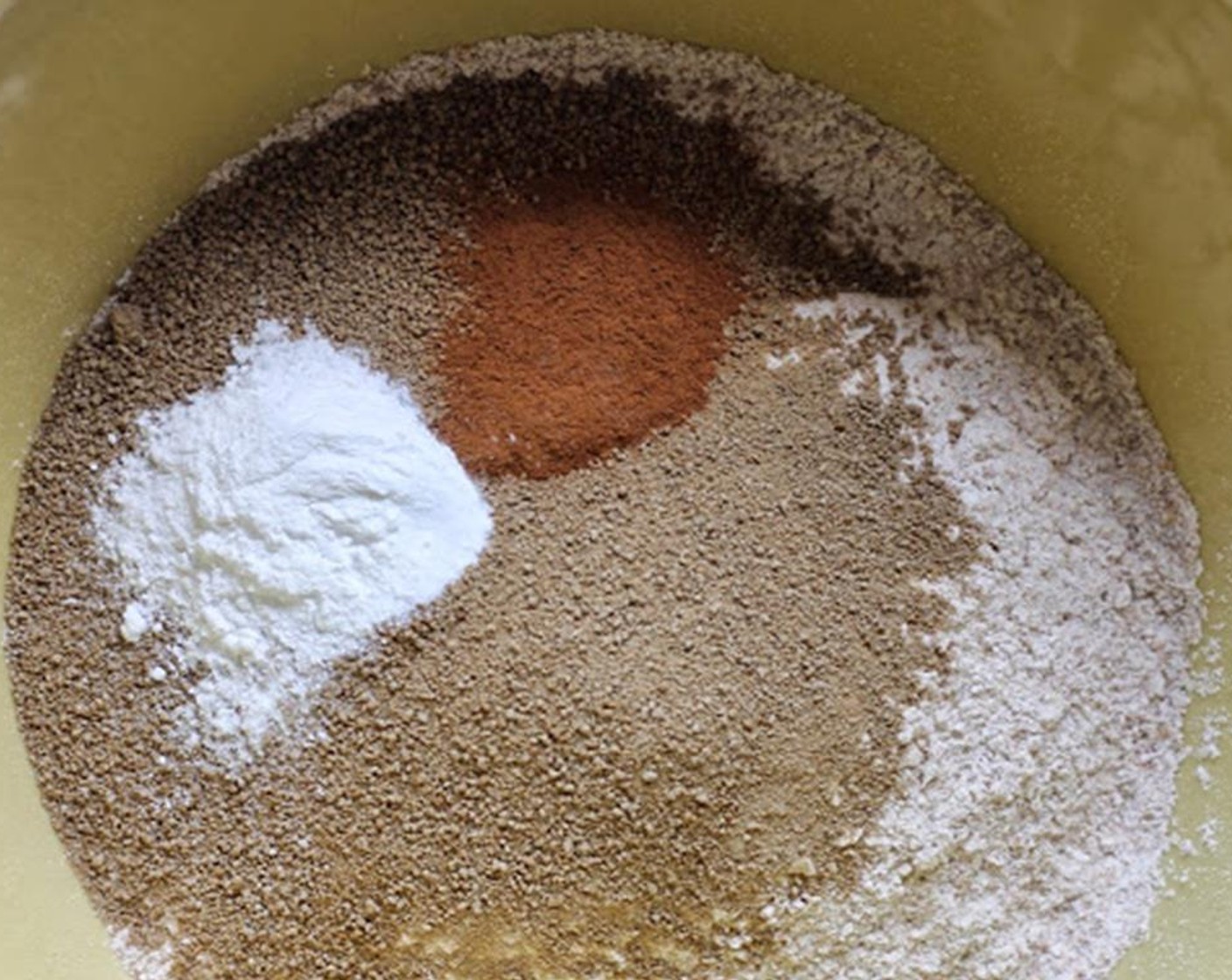 step 3 In a mixing bowl stir together Whole Wheat Flour (2 1/4 cups), Evaporated Cane Sugar (1/2 cup), Baking Powder (1 tsp), Baking Soda (1/2 tsp), Salt (1/2 tsp) and Ground Cinnamon (1/2 tsp). Add Unsweetened Cocoa Powder (1/3 cup) if you want chocolate crackers.