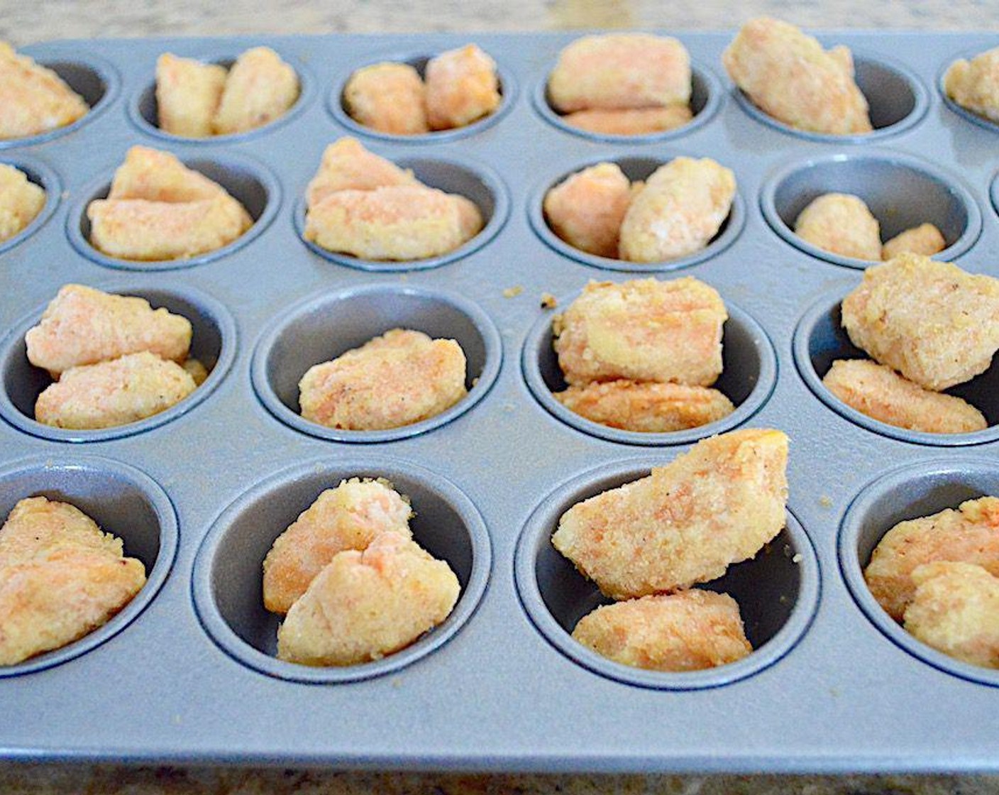 step 2 Put two Frozen Veggie Tots (48) into each well and bake them for 10 minutes. Remove them and let them cool enough to handle but leave the oven on.