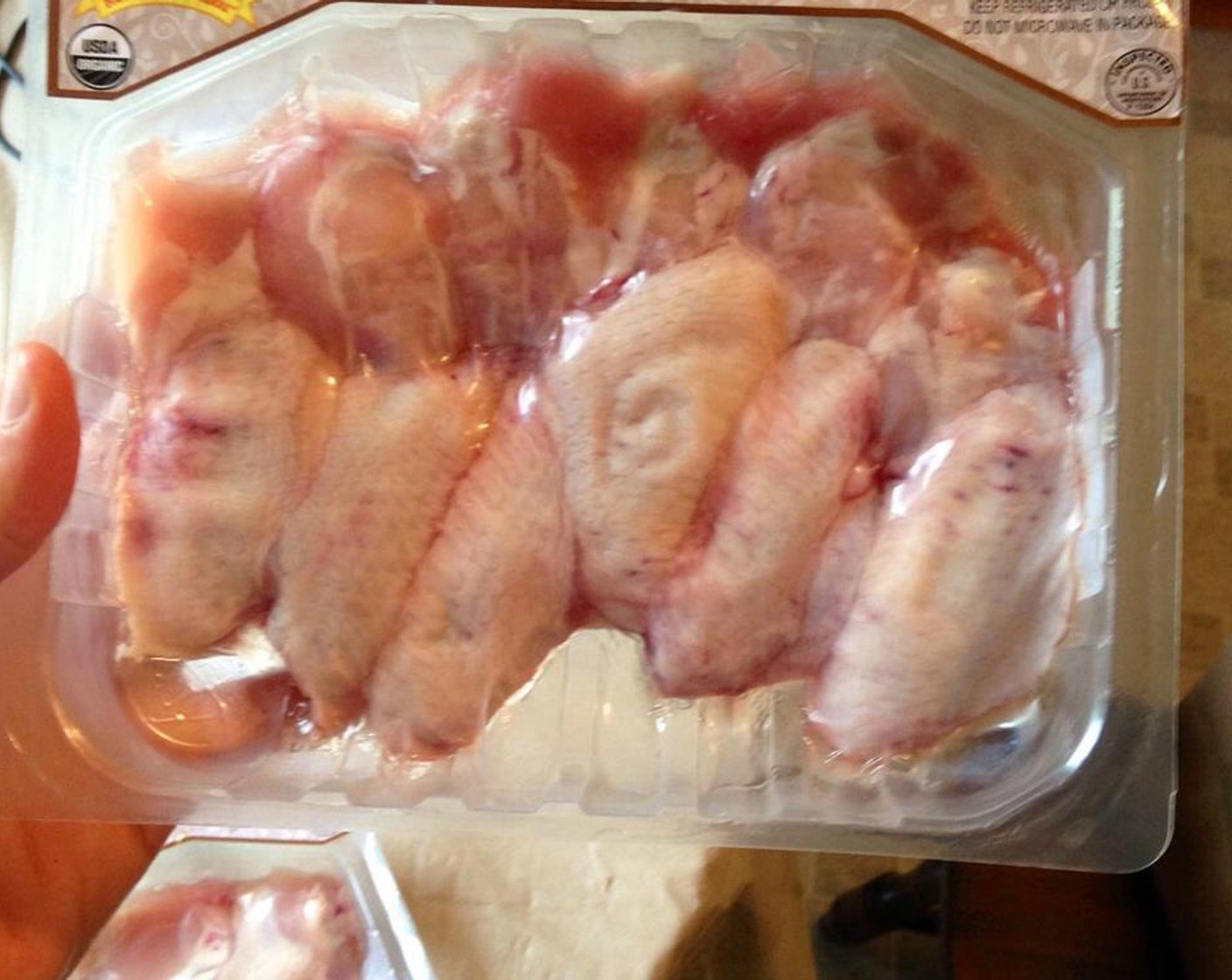 step 2 Season the Chicken Wings (1.5 lb) with Pink Himalayan Sea Salt (1/4 tsp), Ground Black Pepper (1/4 tsp), Simply Organic Garlic Powder (1/2 tsp), Simply Organic Onion Powder (1/2 tsp), Simply Organic Cinnamon, Ground (1/4 tsp), and Fresh Chives (1/2 tsp).