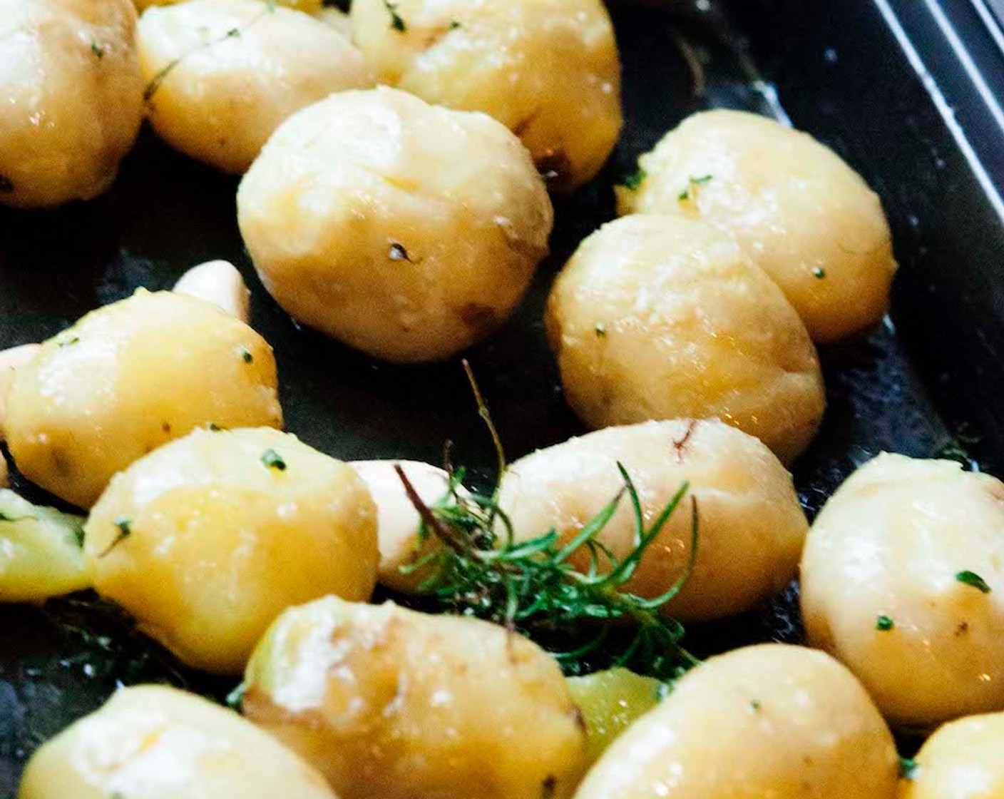 step 4 Add the potatoes onto the tray, season with Salt (to taste) and Ground Black Pepper (to taste) and gently toss them around so they get well coated.