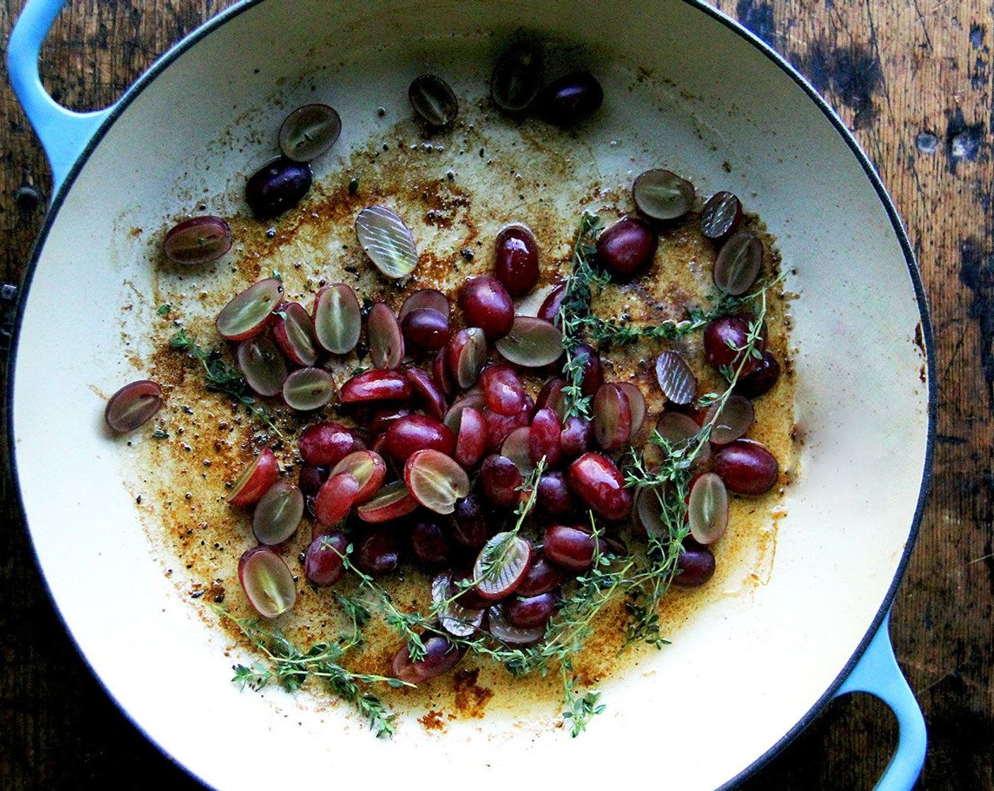 step 7 Add the Red Seedless Grapes (1 1/2 cups) to the skillet and toss with the Fresh Thyme (1 tsp) and a pinch of salt and pepper. Roast in the oven until the grapes are hot and wrinkled in spots, 8 to 10 minutes.