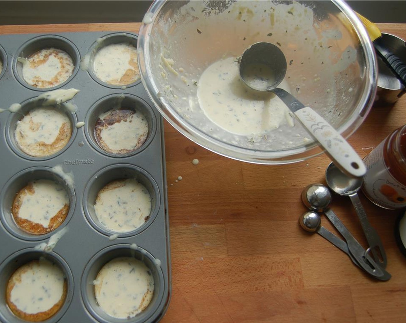 step 4 Butter a standard size muffin tin, or use two mini-muffin tins with the remaining Unsalted Butter (1 Tbsp) and put in the oven until it sizzles.