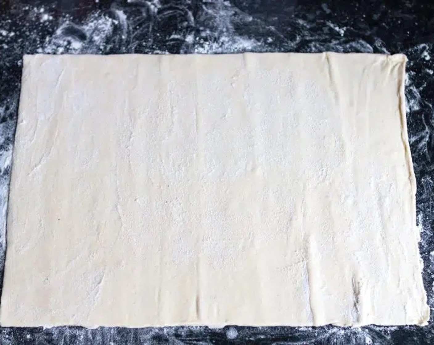 step 2 Sprinkle your worktop with All-Purpose Flour (as needed) and gently layout your Vegan Puff Pastry (11.5 oz).