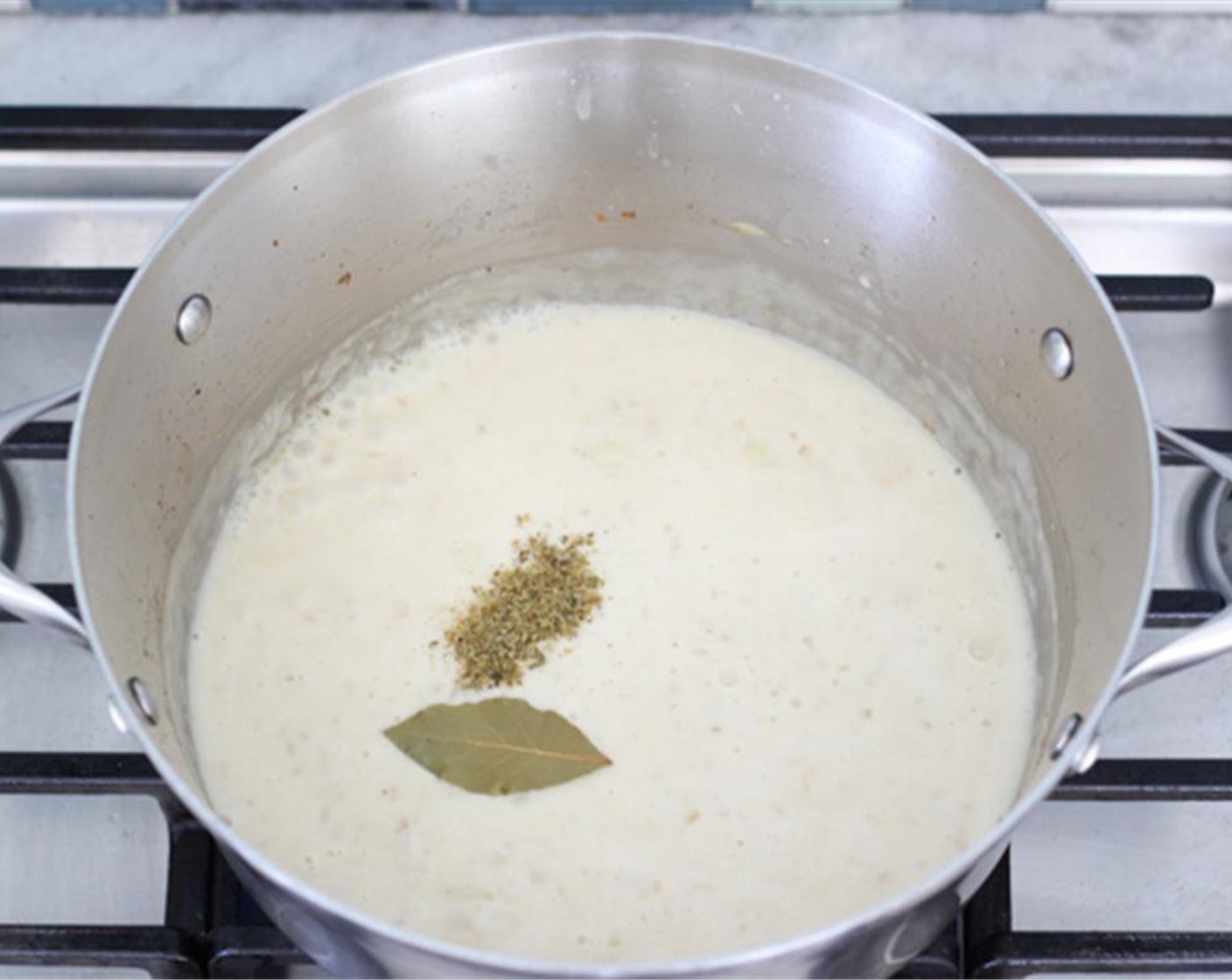 step 9 Add the Bay Leaf (1) the Dried Mixed Herbs (1 tsp) and more ground black pepper and salt to taste. Also add Fresh Herbs (to taste) and combine.