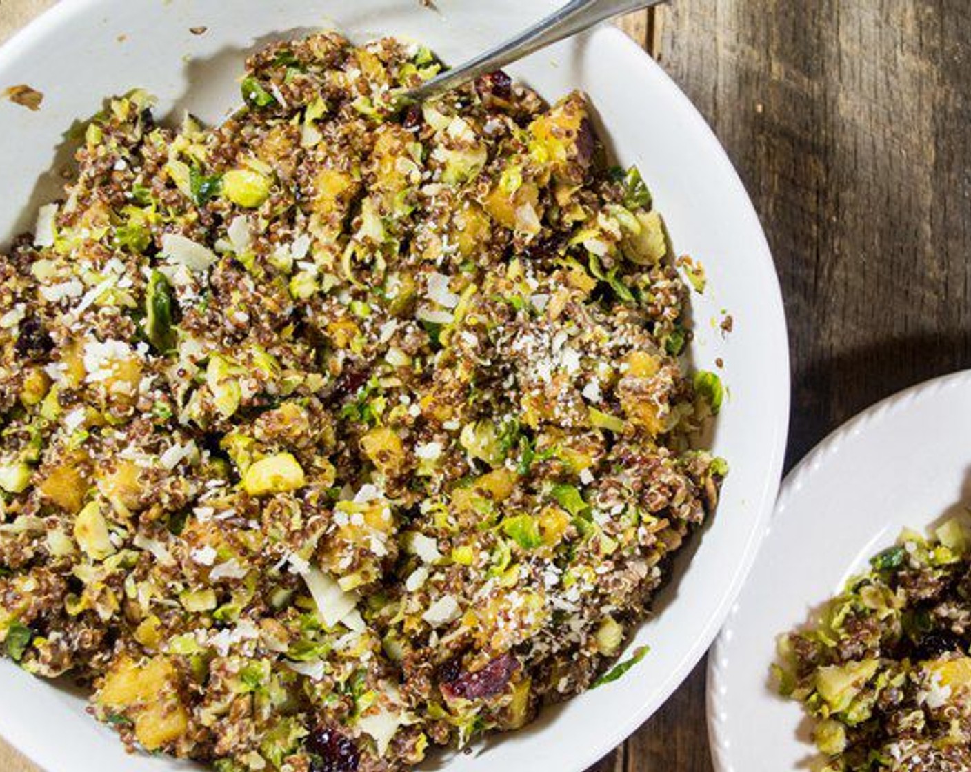 step 7 In a large bowl, combine quinoa, brussels sprouts, acorn squash mix, and Parmesan Cheese (1/2 cup), toss and serve with extra parmesan cheese, if desired. Eat!
