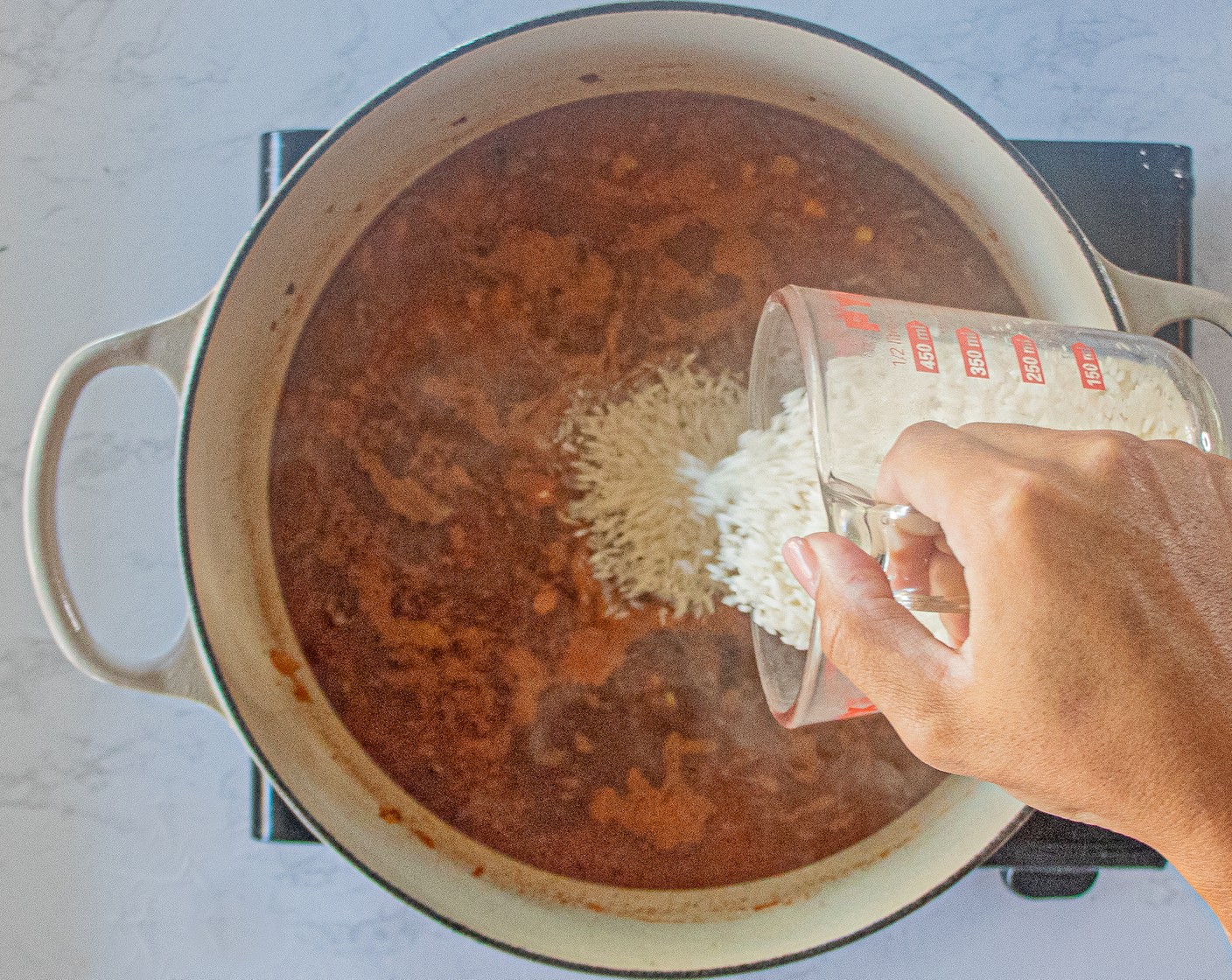 step 6 Add the Chicken Broth (2 1/2 cups), Long Grain White Rice (1 3/4 cups), Canned Corn (1 1/3 cups), Canned Black Beans (1 cup), and Salt (1/2 tsp) and stir well.