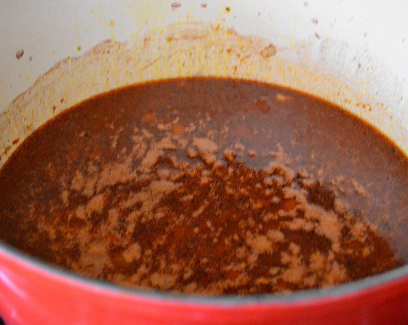 step 2 Once it is completely cooked add in the Garlic (3 cloves), Onion (1), and Tomato Paste (2 Tbsp). Let them cook and get fragrant for just a minute while you stir them in. Lastly, pour in that lovely bottle of Dry Red Wine (3 cups). Let the sauce gently boil for 10 minutes.