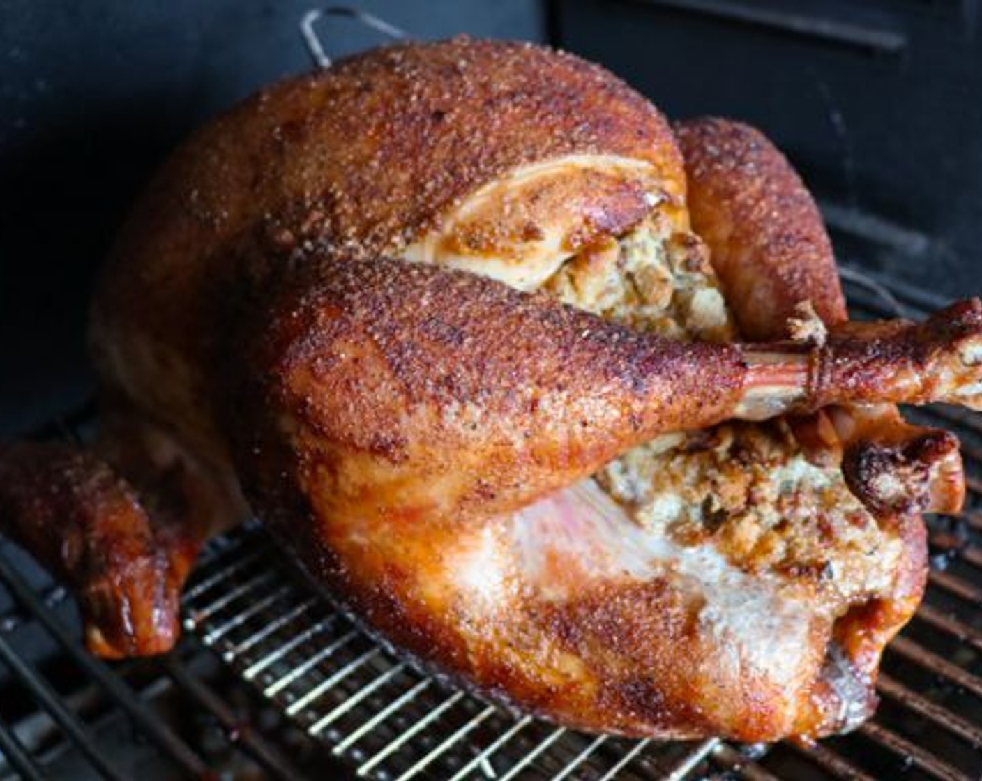 step 7 Place the turkey on the smoker and cook until an internal temperature of 165 degrees F (73 degrees C) in the breast. Be sure to check the internal temperature of the stuffing as well. It also needs to reach 165 degrees F before serving.