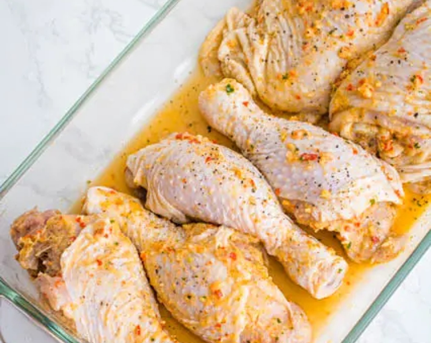 step 6 Once ready, place the chicken on a baking dish in a single layer. Pour all of the remaining marinade over the chicken.