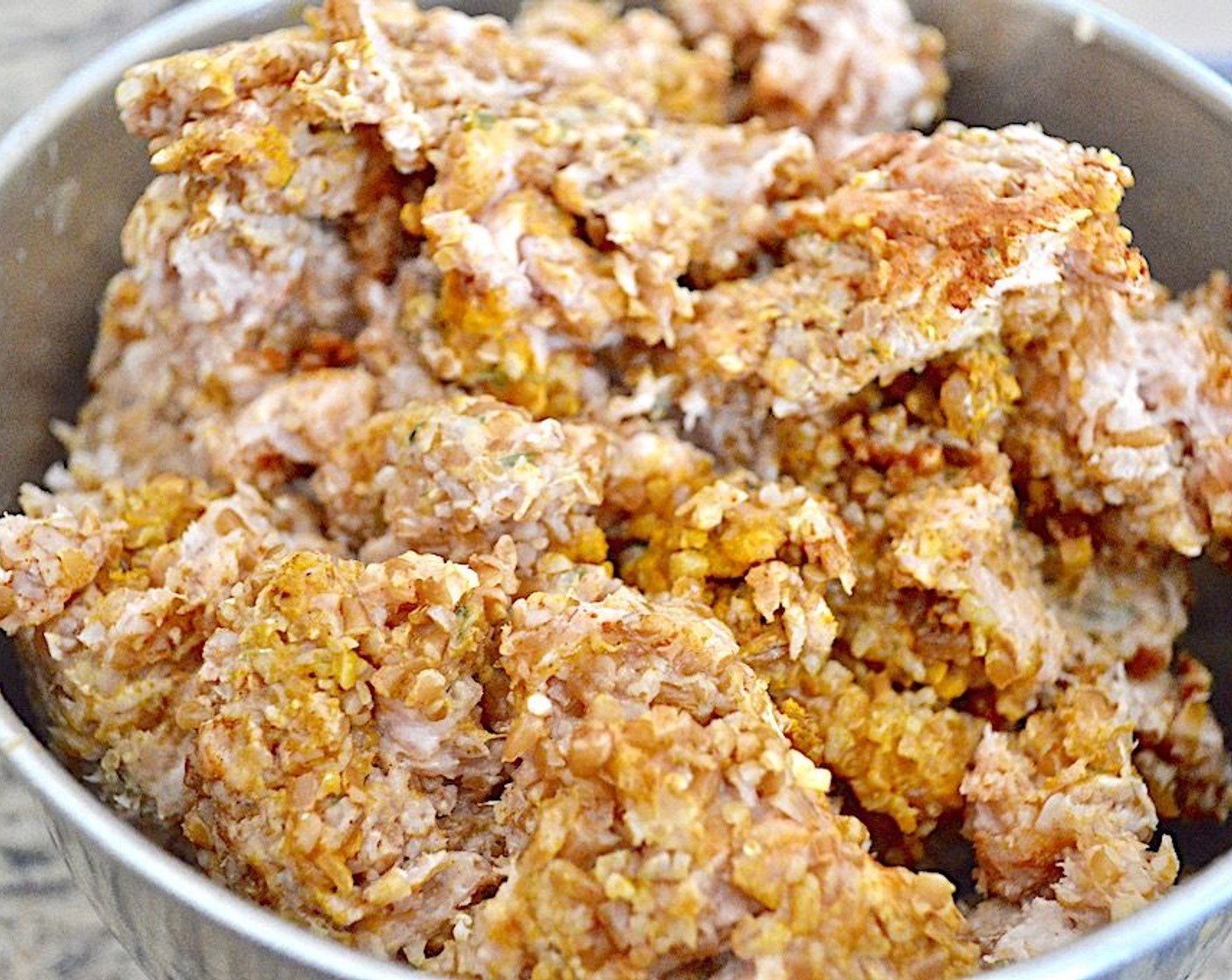 step 5 Add Dried Onions (1 tsp), McCormick® Garlic Powder (1 tsp), Ground Cumin (1 tsp), Ground Cinnamon (1 tsp), Ground Turmeric (1 tsp), and Paprika (1/2 tsp) with the Ground Chicken (2 lb) and mix it all together thoroughly so that it holds together well, like a meatloaf.