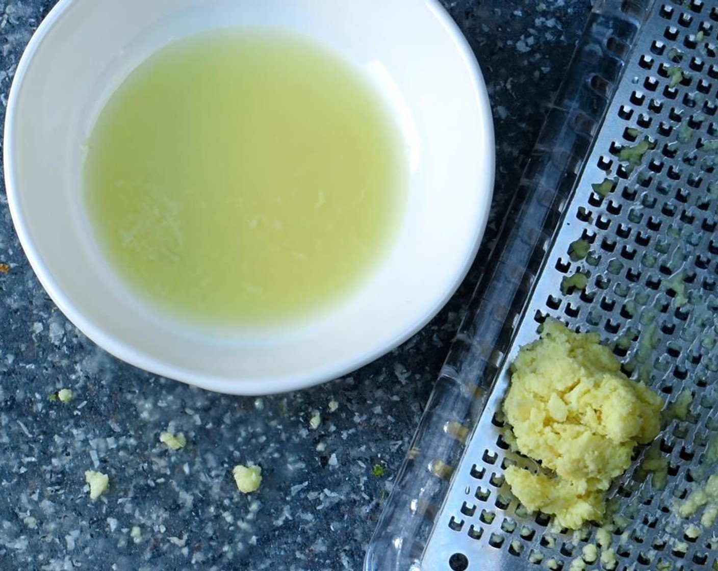 step 10 Carefully scoop the ginger pulp into your hand or into a fine mesh sieve. Squeeze the pulp over a small bowl to capture all the ginger juice. Discard the ginger solids.