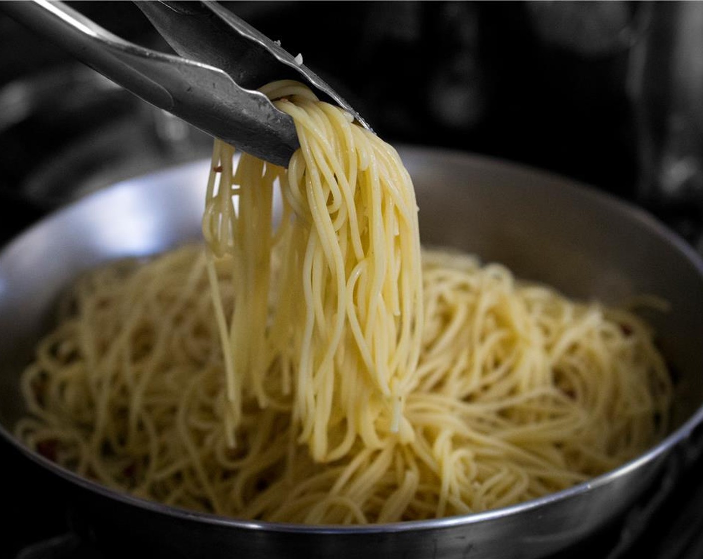 step 6 Add the drained pasta to the pan with the pancetta. Toss until well mixed. Add the egg mixture and 1/4 cup of the reserved pasta water, and quickly toss to coat the pasta. Toss quickly and constantly so the egg creates a creamy sauce.