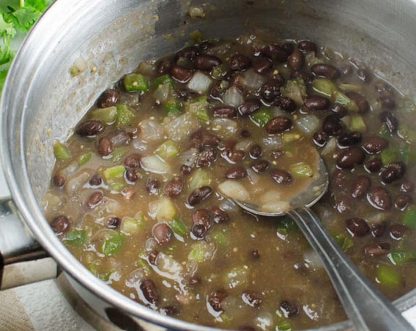 step 8 Stir in the Canned Black Beans (1 cup) (liquid and all) and Salsa Verde (1/4 cup). Heat to boil and reduce heat to a medium simmer, cook for 5 minutes.