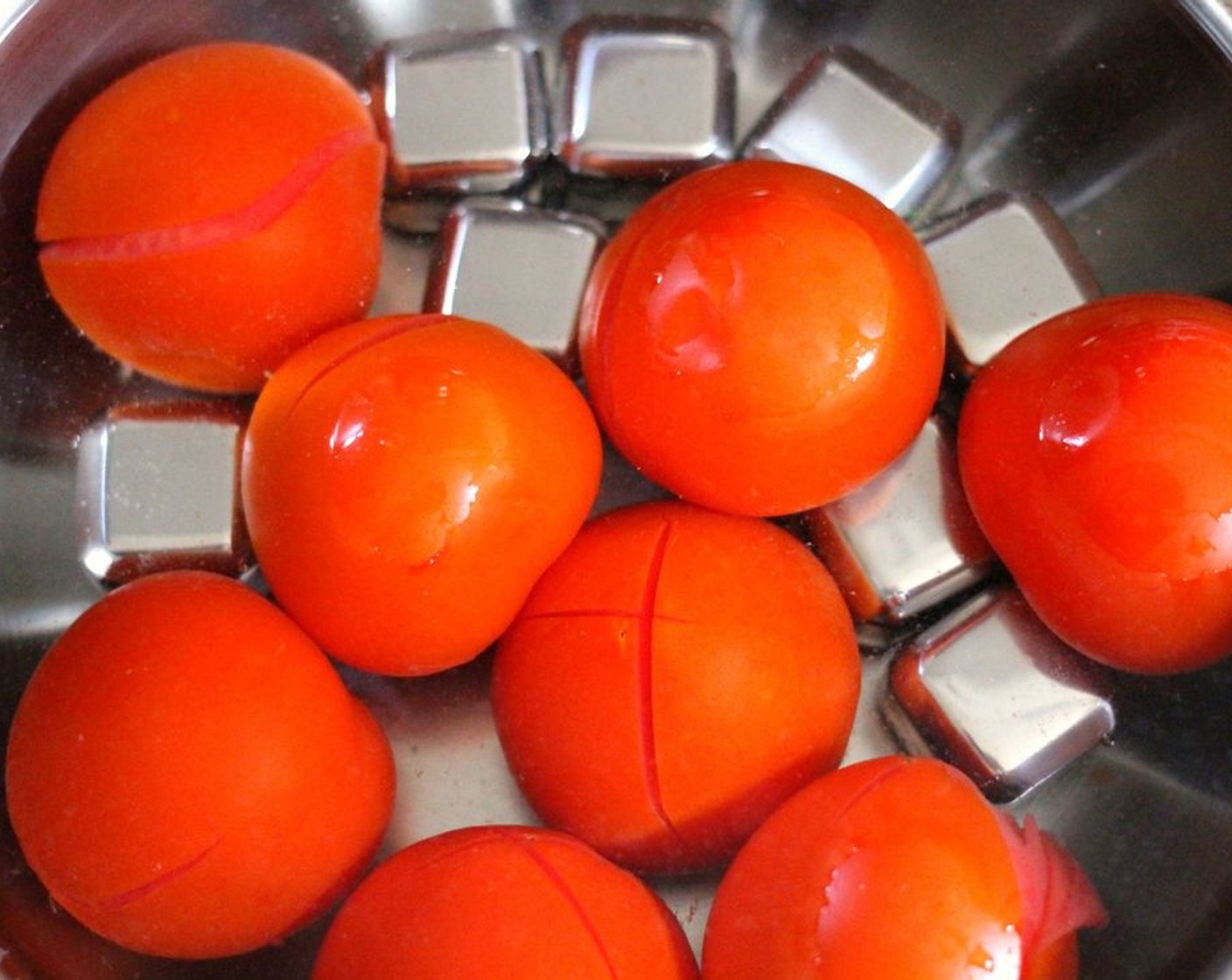 step 3 Remove the tomatoes and place an Ice (to taste) bath to stop the cooking.