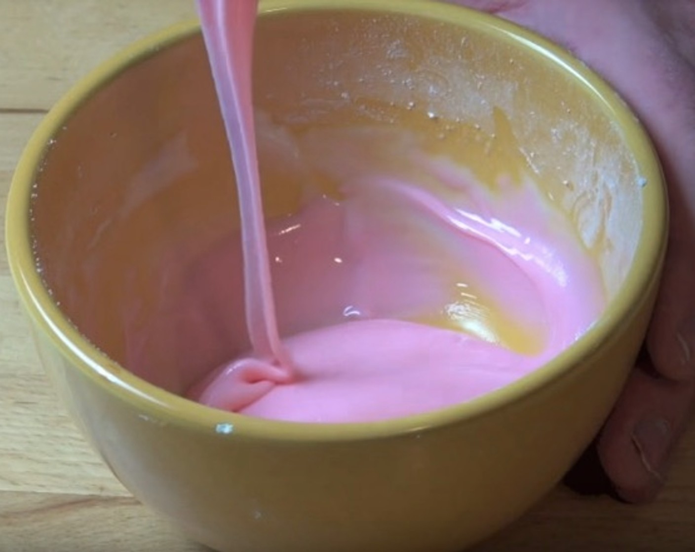 step 9 For the icing, sift Powdered Confectioners Sugar (1 cup) into a bowl. Add Vanilla Extract (1 Tbsp) and Milk (1 Tbsp). Stir together. Add Red Food Coloring (to taste) and mix in.