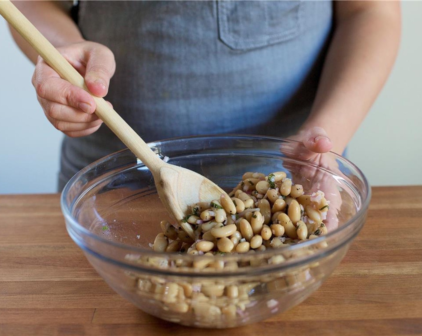 step 5 In the same bowl as the cannelloni beans, add the Rice Vinegar (1 Tbsp), Salt (1/4 tsp), and Ground Black Pepper (1/4 tsp). Drizzle with Olive Oil (2 Tbsp). Mix to combine and set aside.