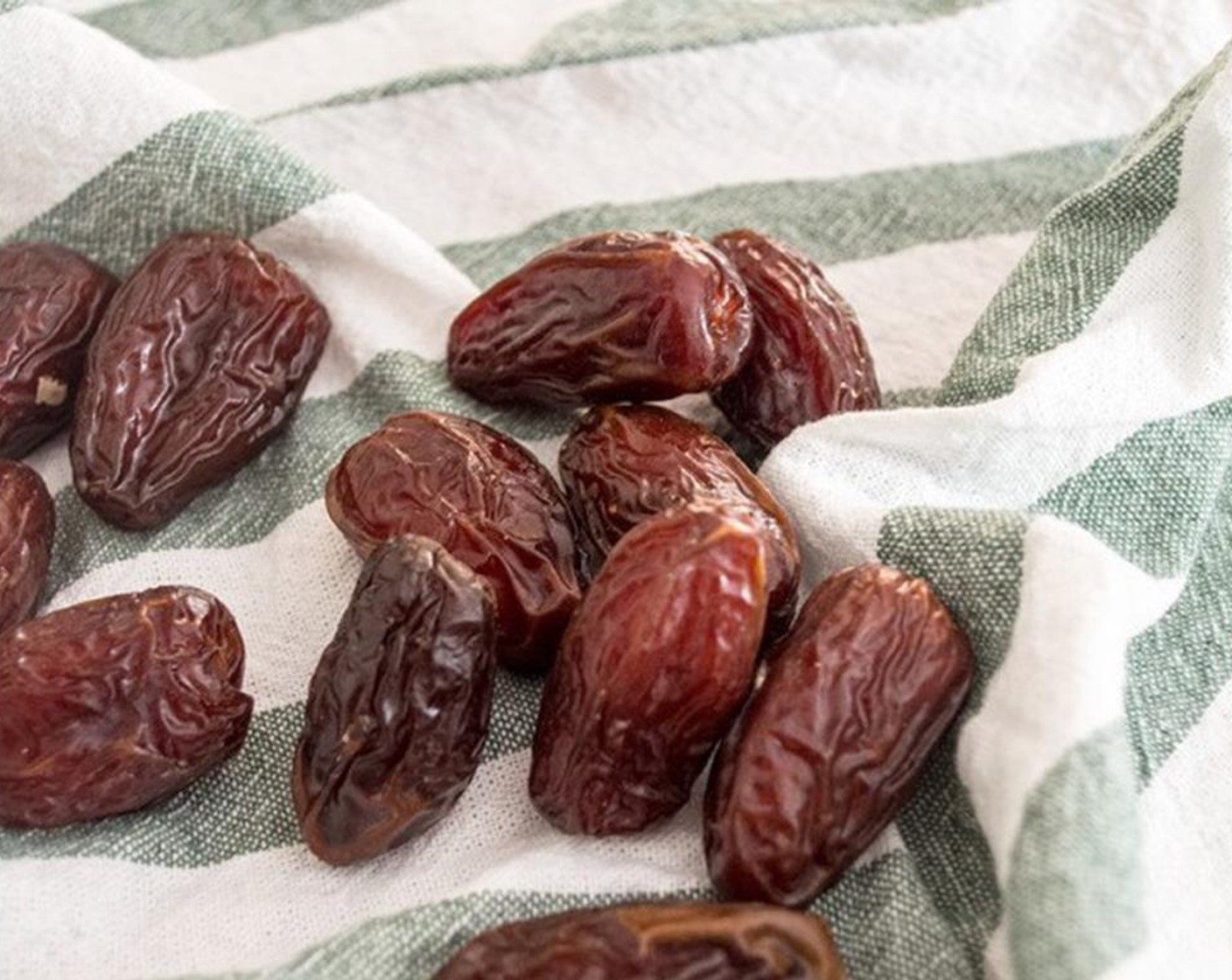 step 1 Remove pits from Medjool Dates (12) and add dates and Oats (1 1/2 cups) to food processor and process until finely chopped and blended.