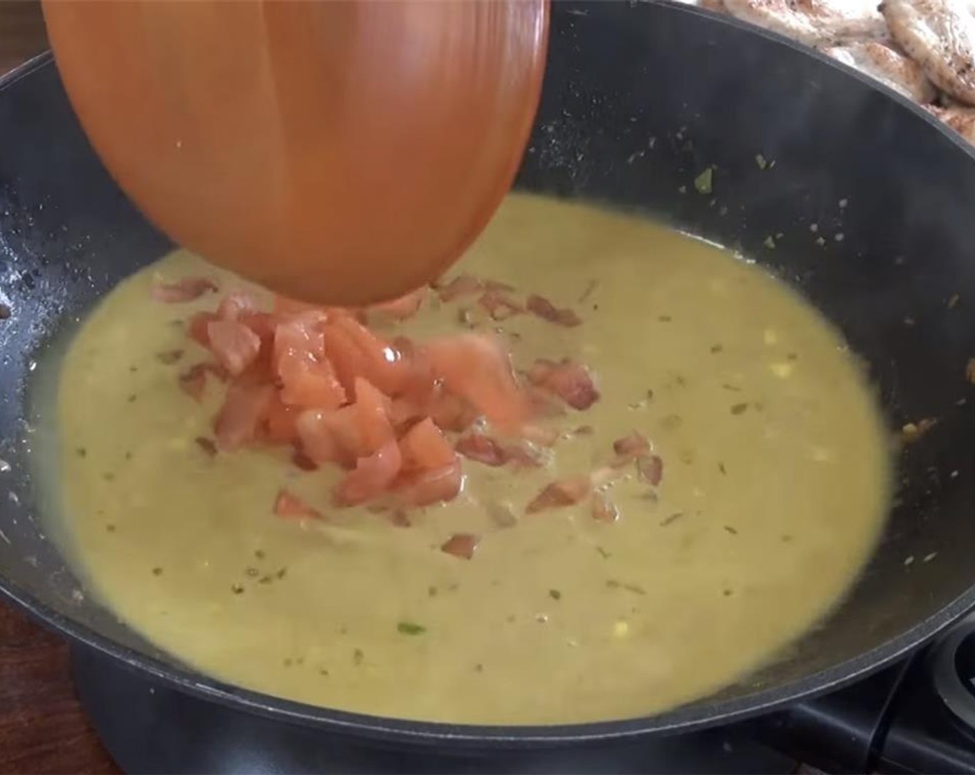 step 7 Add the Chicken Broth (1 cup), Coconut Milk (14 fl oz), and Tomatoes (3). Mix everything together.