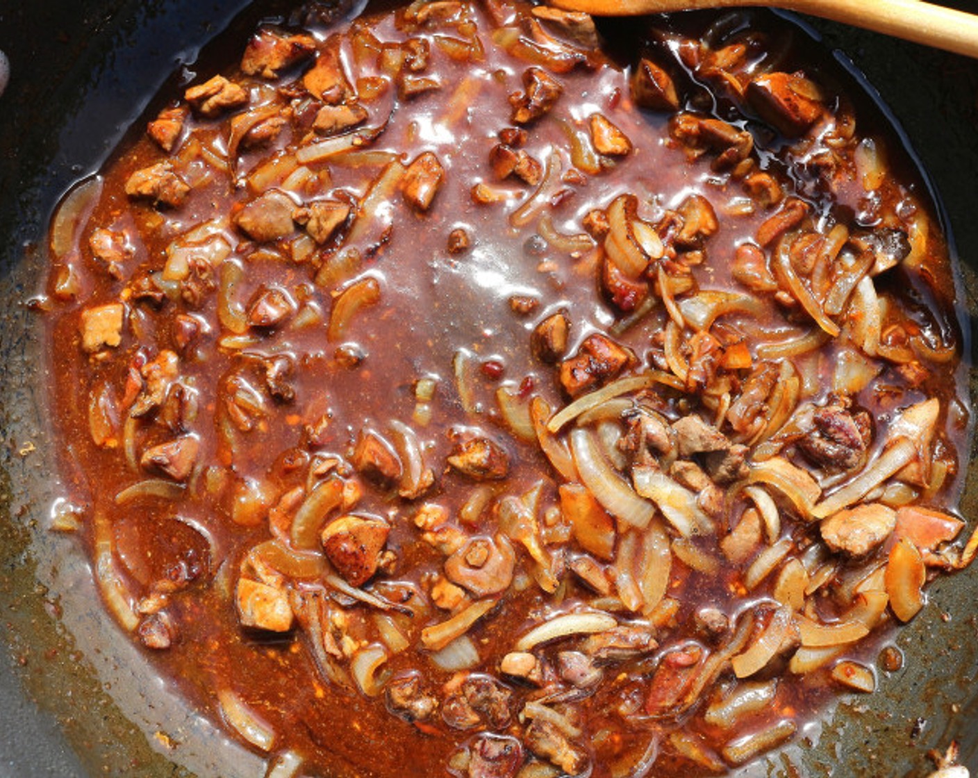 step 9 Add the sauce, simmer for one minute.