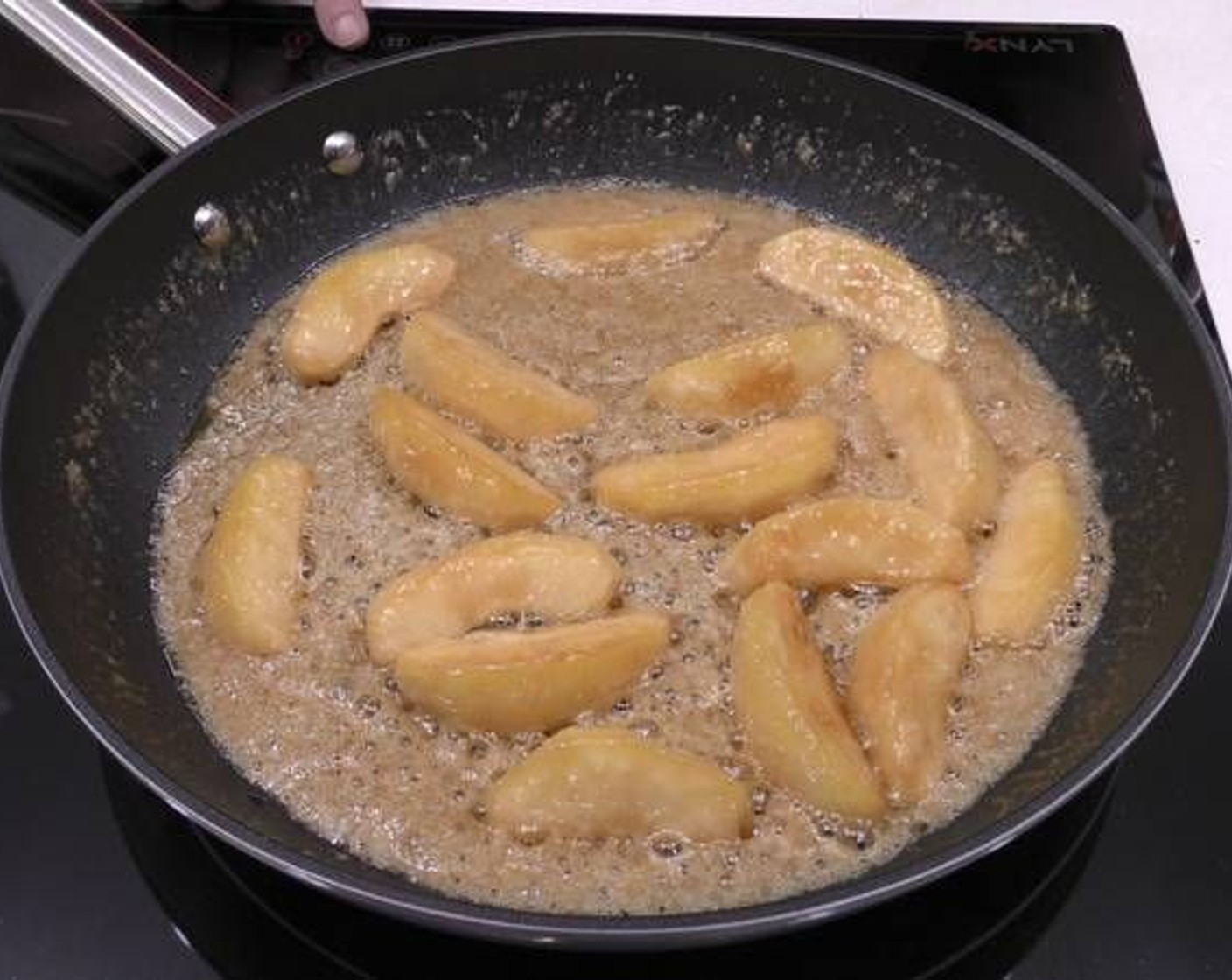 step 3 Little by little you'll see the butter and sugar will mix and start turning a golden color. This will start cooking the apple and make it soft and tender.