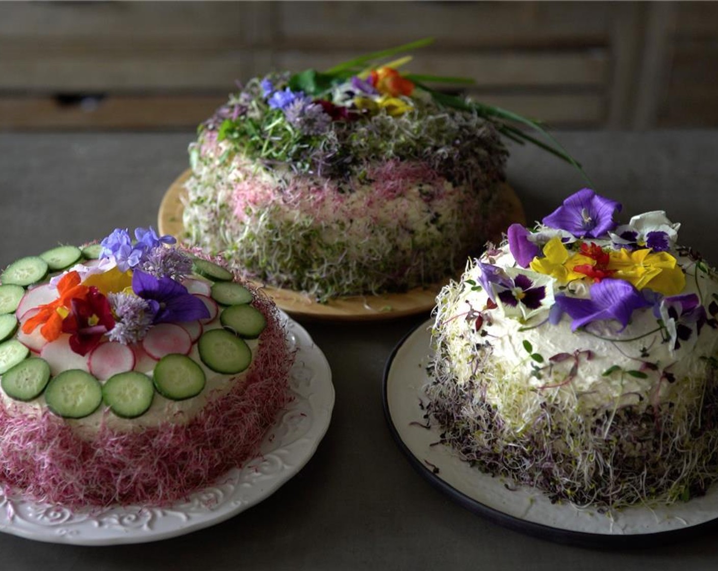 step 14 Decorate the sides of the Ham and Cheese Cake with Multi-Colored Sprouts (to taste) and decorate the top of the cake with Edible Flowers (to taste).