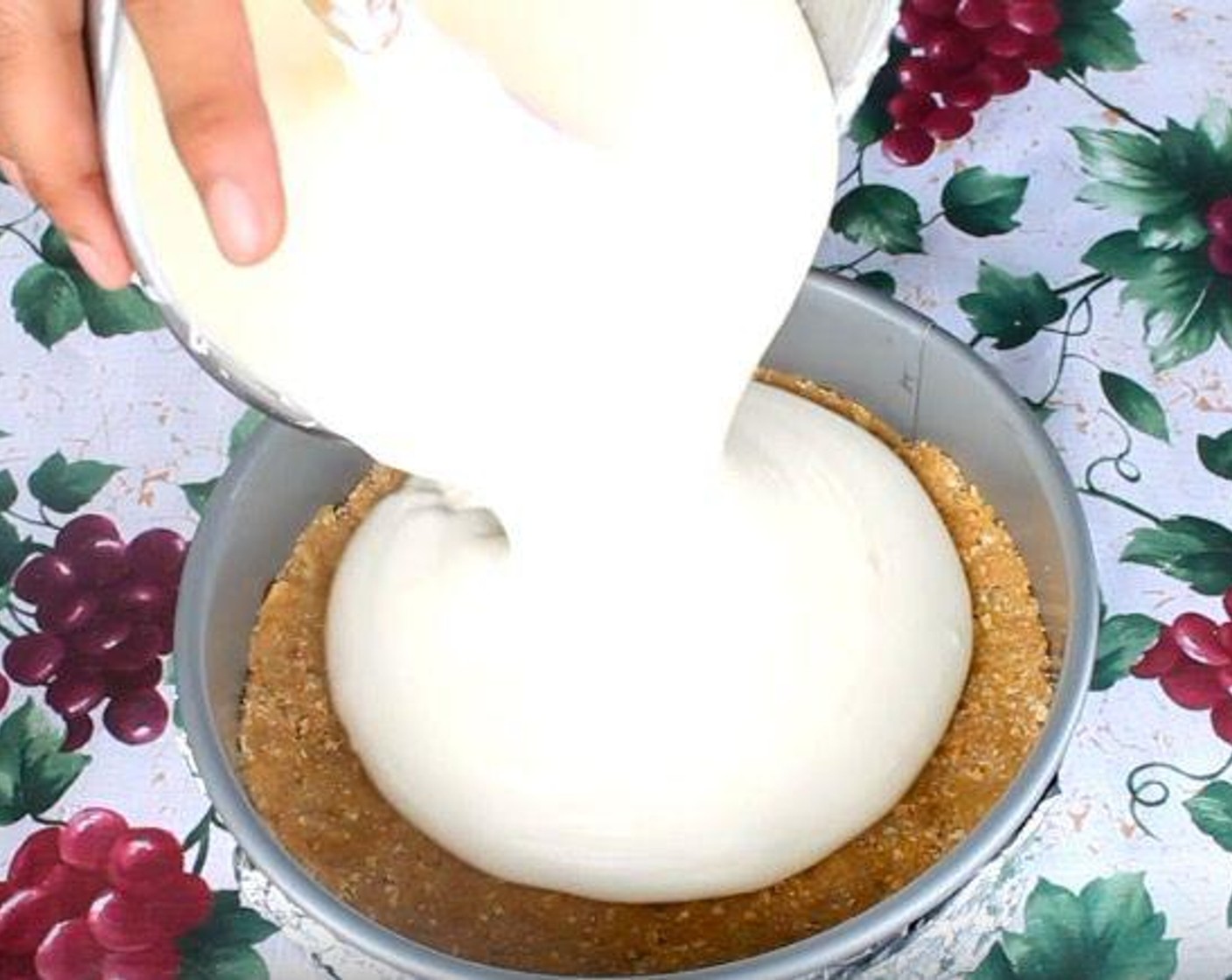 step 6 Transfer cream cheese mixture into the springform pan over the graham cracker crust.