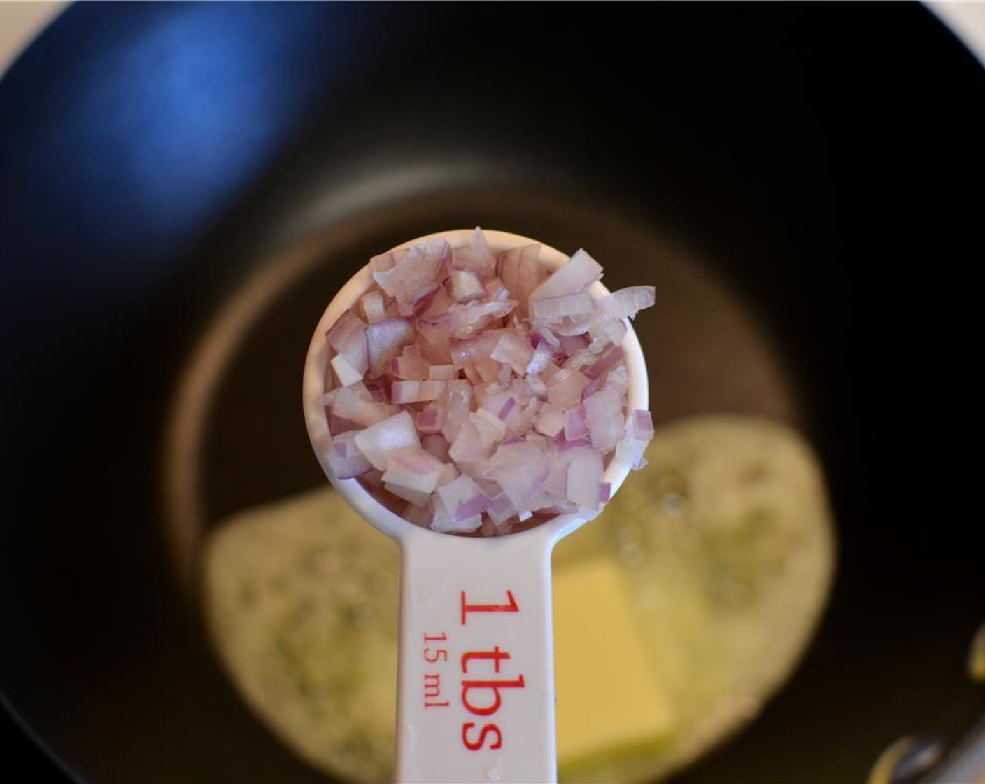 step 6 Add the Shallots (2 Tbsp) and sauté it for a minute or two until they turn soft and translucent.