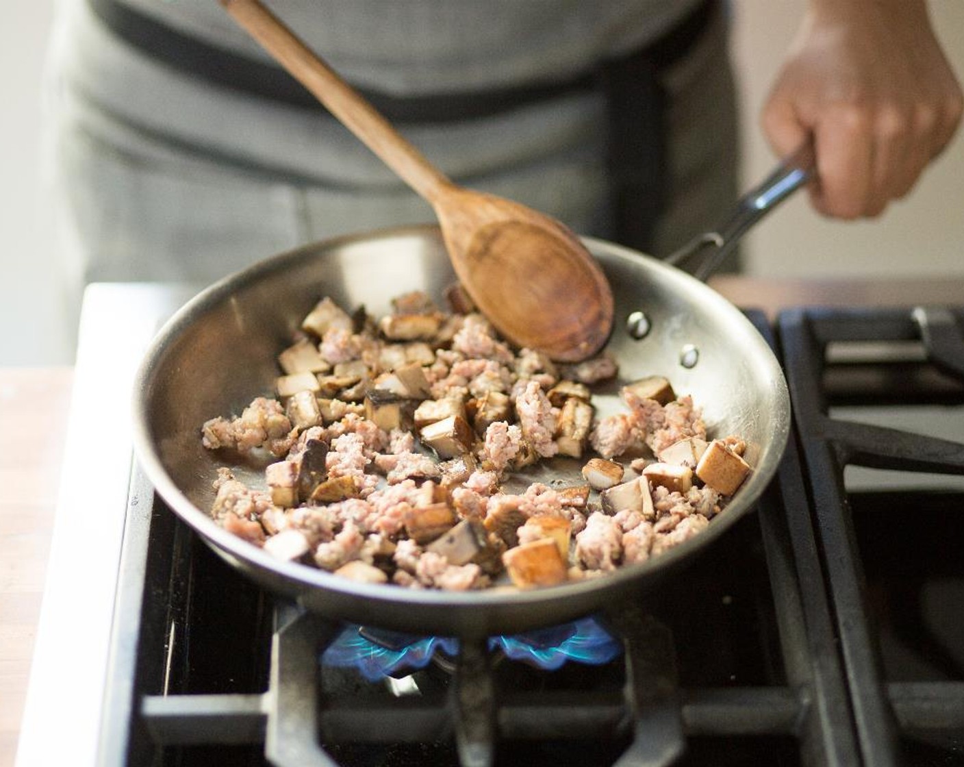 step 13 Remove the casings from the links of the Turkey Sausages (2) and discard casings. Crumble the sausage into the hot pan. Sauté until browned for about 5 minutes.