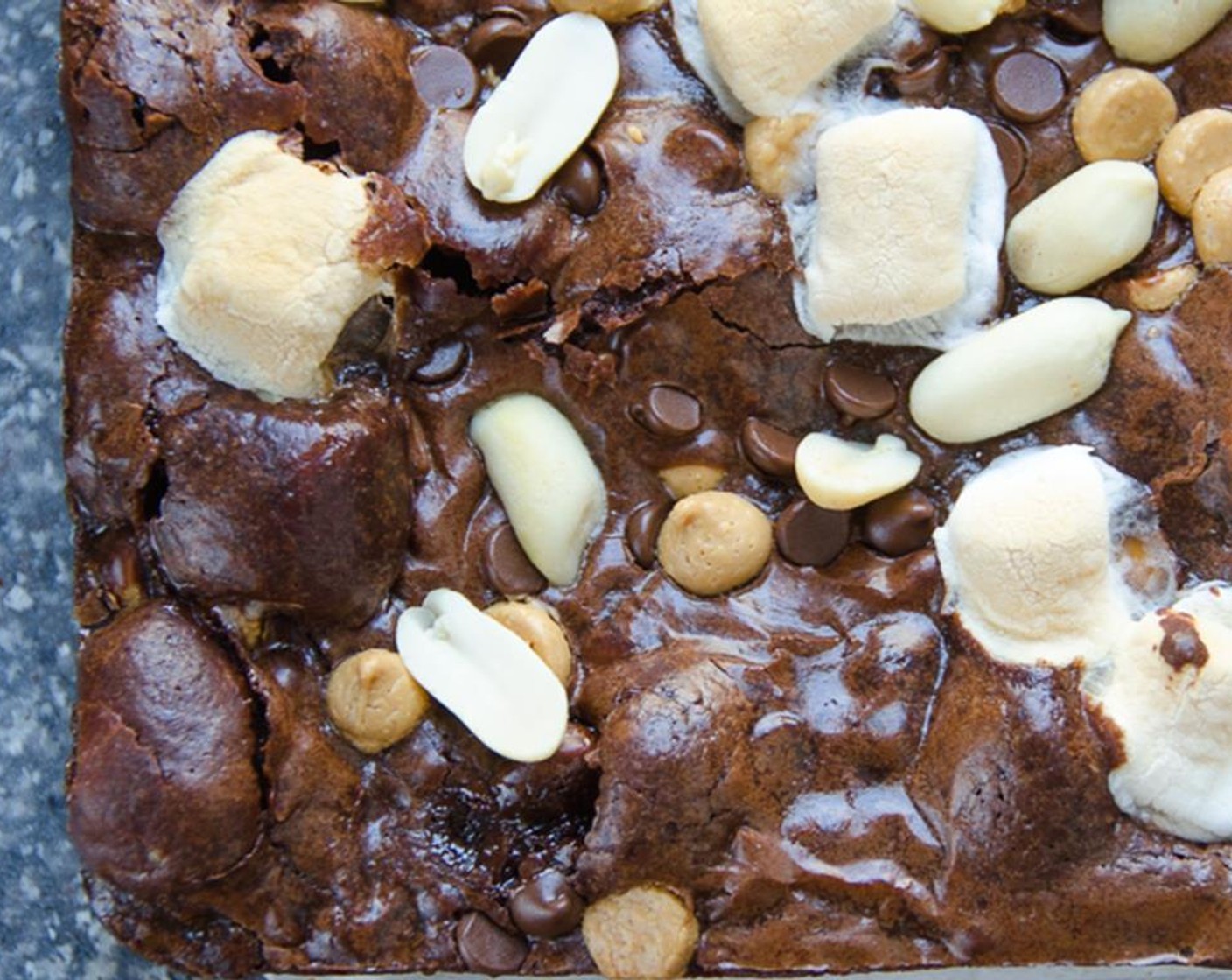 step 7 Bake for 25 to 30 minutes and check for doneness with a cake tester or toothpick. If it comes out with just a few crumbs, the brownies are done. If you cook them too long, they'll be more cake-y than fudgy. If the batter is still liquidy, cook for an additional 3 to 5 minutes.