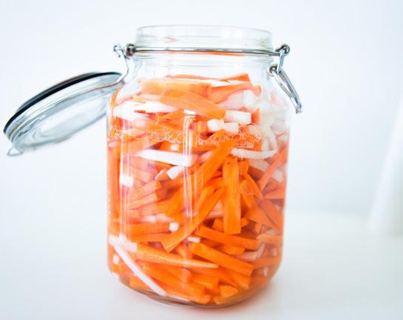 step 4 Add vegetables to the glass jar, including any juices, and push down as much as you can. Ensure there is at least a 2-inch gap from the top to avoid leakage and spillage.