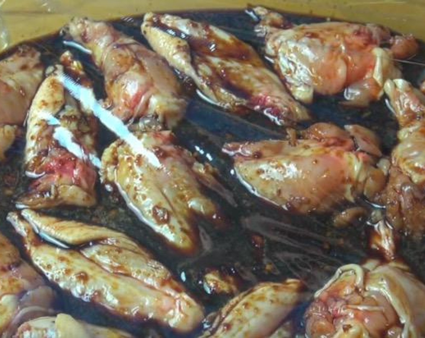 step 2 In a large dish, arrange Chicken Wings (2.2 lb) and pour marinade over until everything is coated. Cover with plastic wrap and place in fridge to marinate for at least 2 hours, or up to overnight.