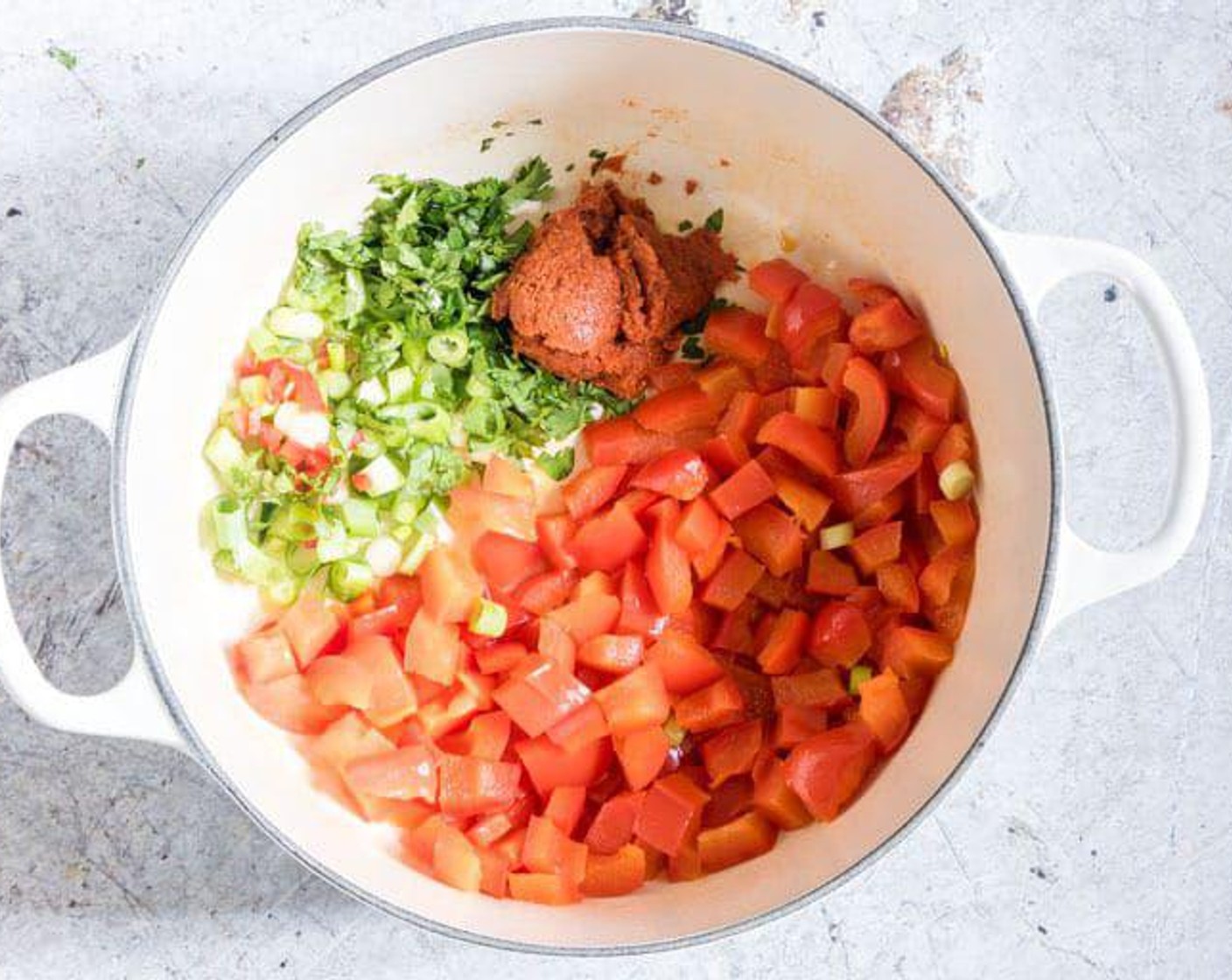 step 2 Add the Scallion (1 bunch), Thai Red Curry Paste (1 Tbsp), Fresh Cilantro (2 Tbsp) and Chili Pepper (1/4 tsp),  and stir-fry for 1 minute until fragrant.