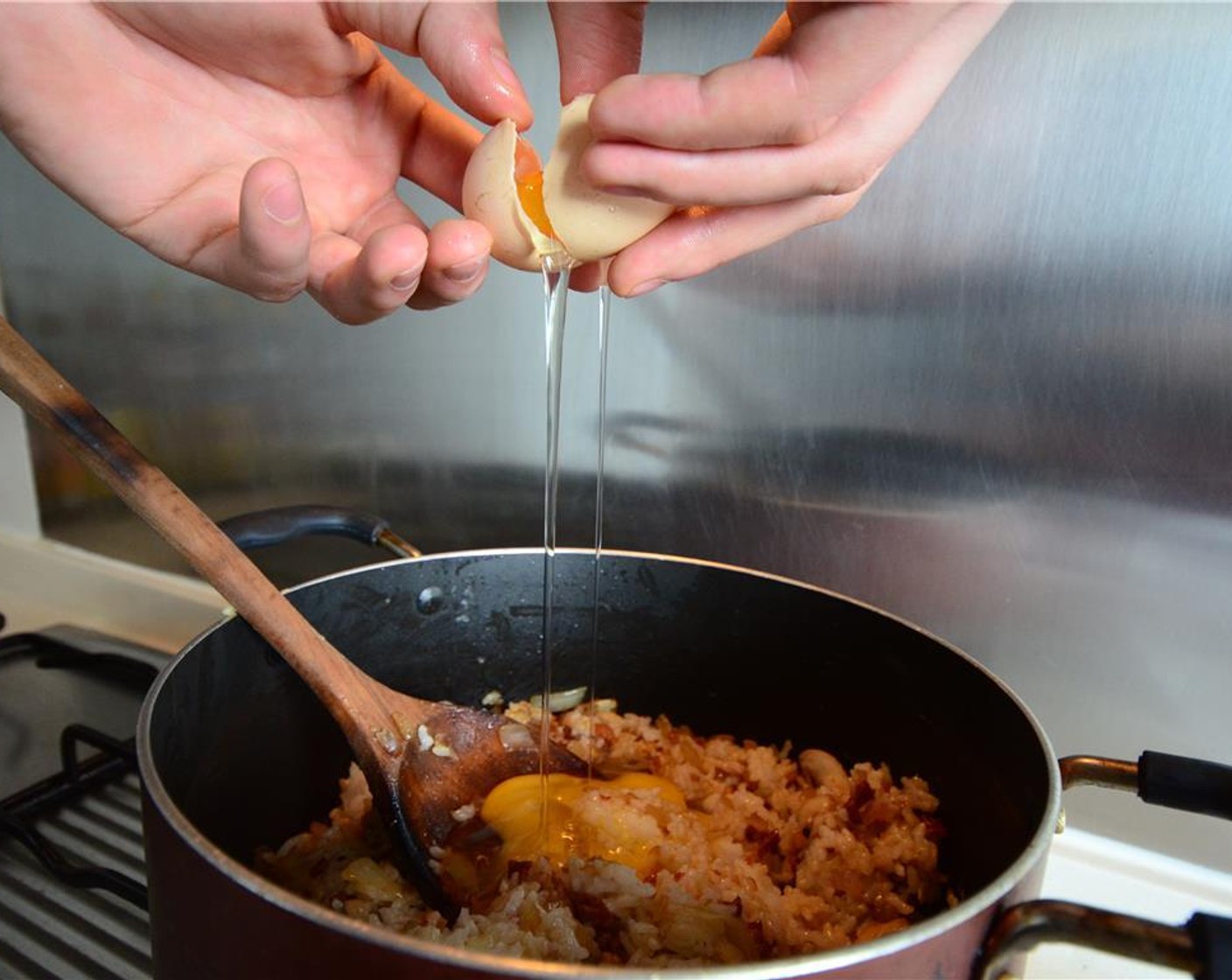 step 9 Crack in the Egg (1), stir and cook until the egg has solidified.