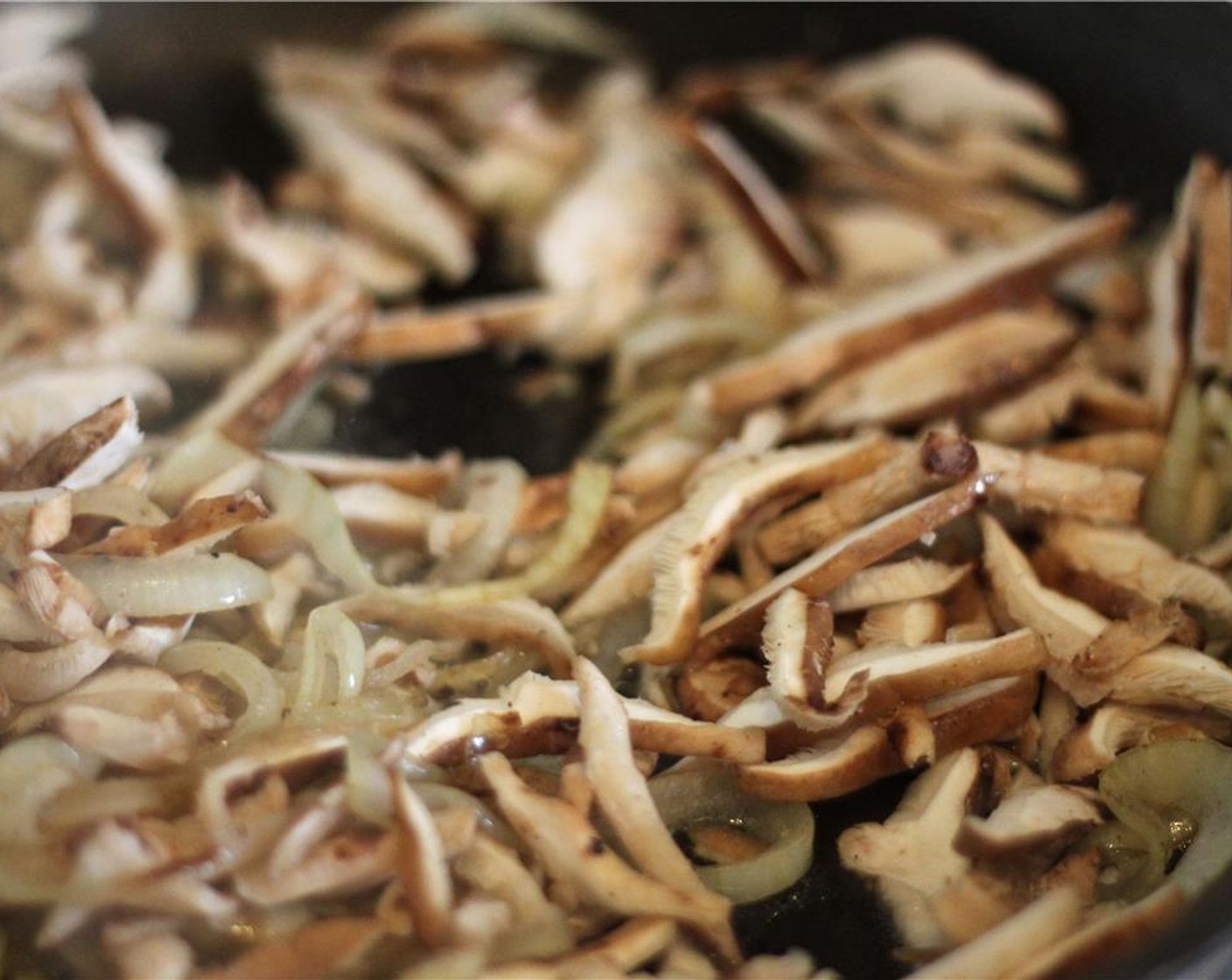 step 6 Add the remaining Butter (1/2 Tbsp), melt and add the shitake mushroom and Vegetable Stock (1/4 cup). Season with salt. Turn up the heat and sautee until browned.