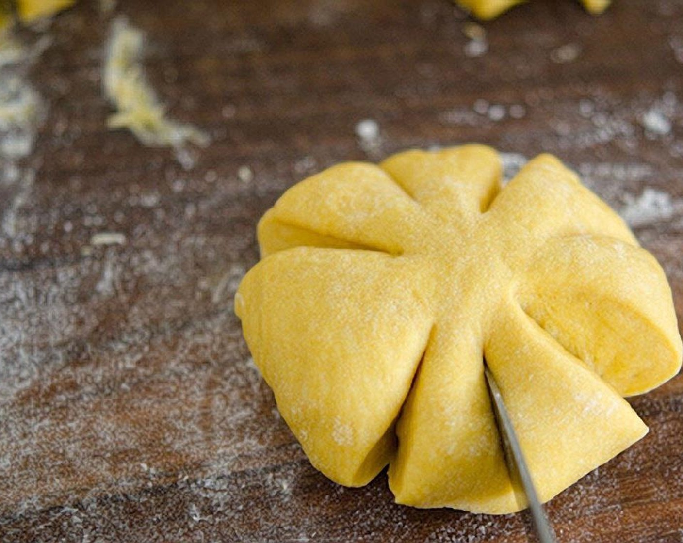 step 13 Using a knife, give 8 segments of cut on the edge but leave the center uncut. It'll look like a flower!