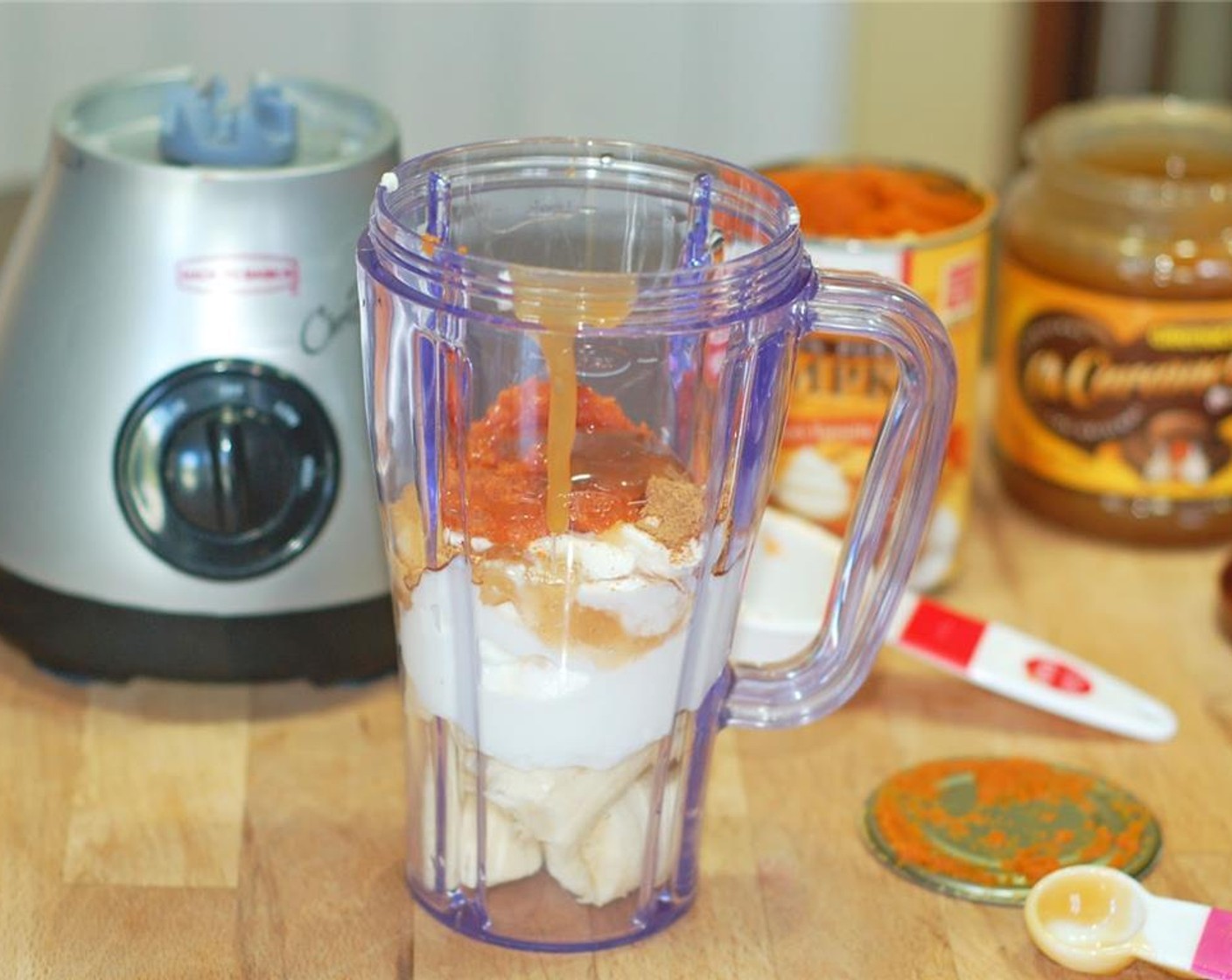 step 1 Chop the Banana (1) and place in the blender. Add Apple Cinnamon Greek Yogurt (2/3 cup), Canned Pumpkin Purée (4 Tbsp), Pumpkin Pie Spice (1/2 tsp), and Caramel Sauce (1 tsp). Pour in Milk (1 cup). Blend 1-2 minutes or until smooth.