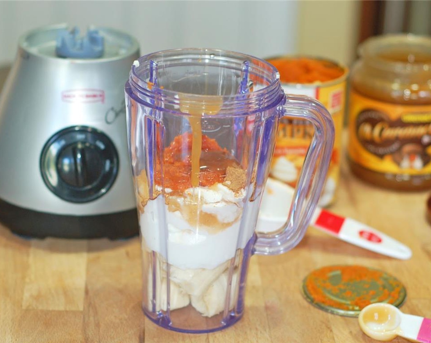 step 1 Chop the Banana (1) and place in the blender. Add Apple Cinnamon Greek Yogurt (2/3 cup), Canned Pumpkin Purée (1/4 cup), Pumpkin Pie Spice (1/2 tsp), and Caramel Sauce (1 tsp). Pour in Milk (1 cup). Blend 1-2 minutes or until smooth.