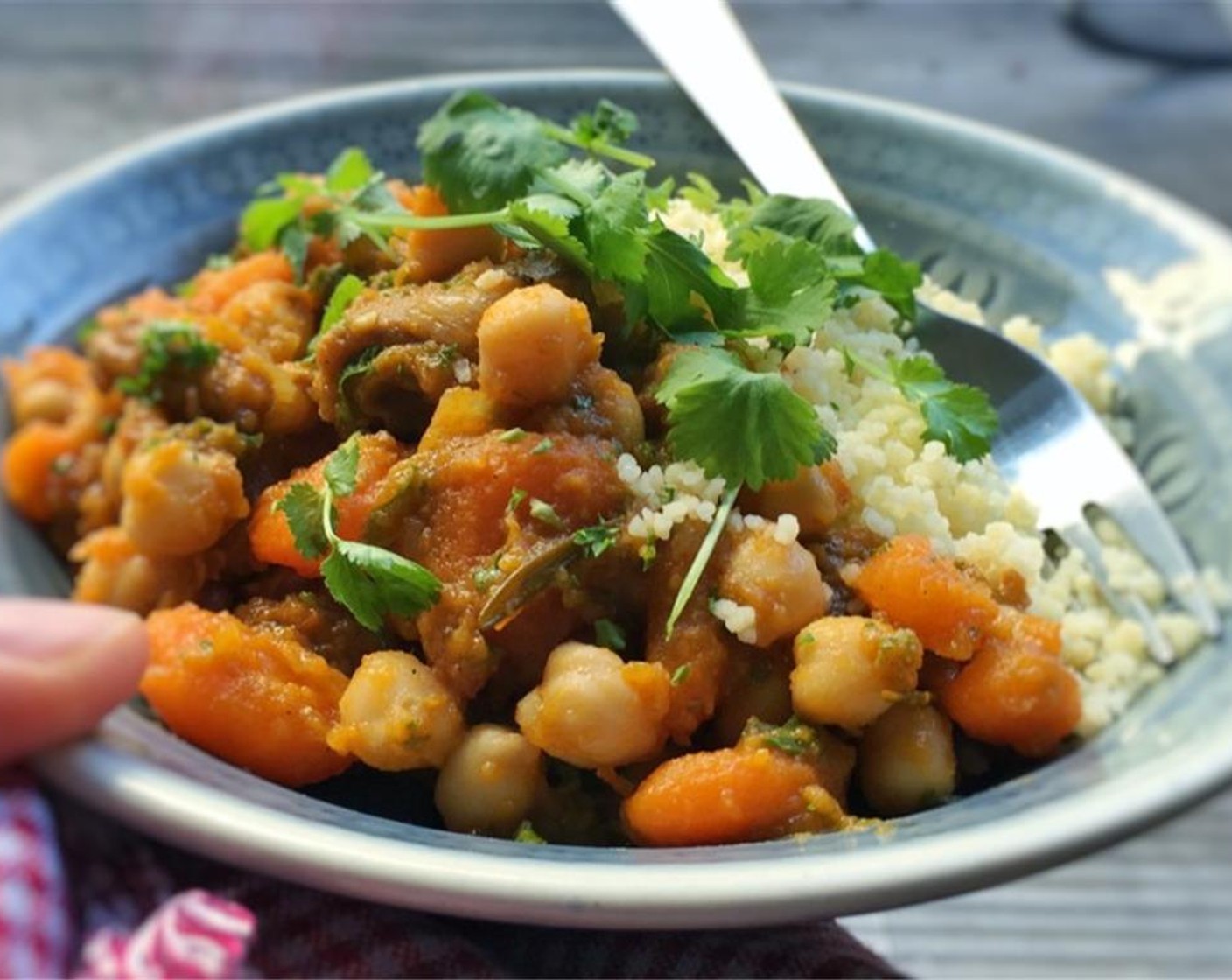 step 7 Stir and take the stew off the heat. Scoop it onto deep plates, serve with couscous, and enjoy!