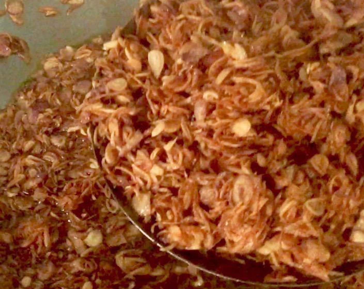 step 6 Remove fried shallots from oil using a slotted spoon. Keep the shallot infused oil in a covered container.