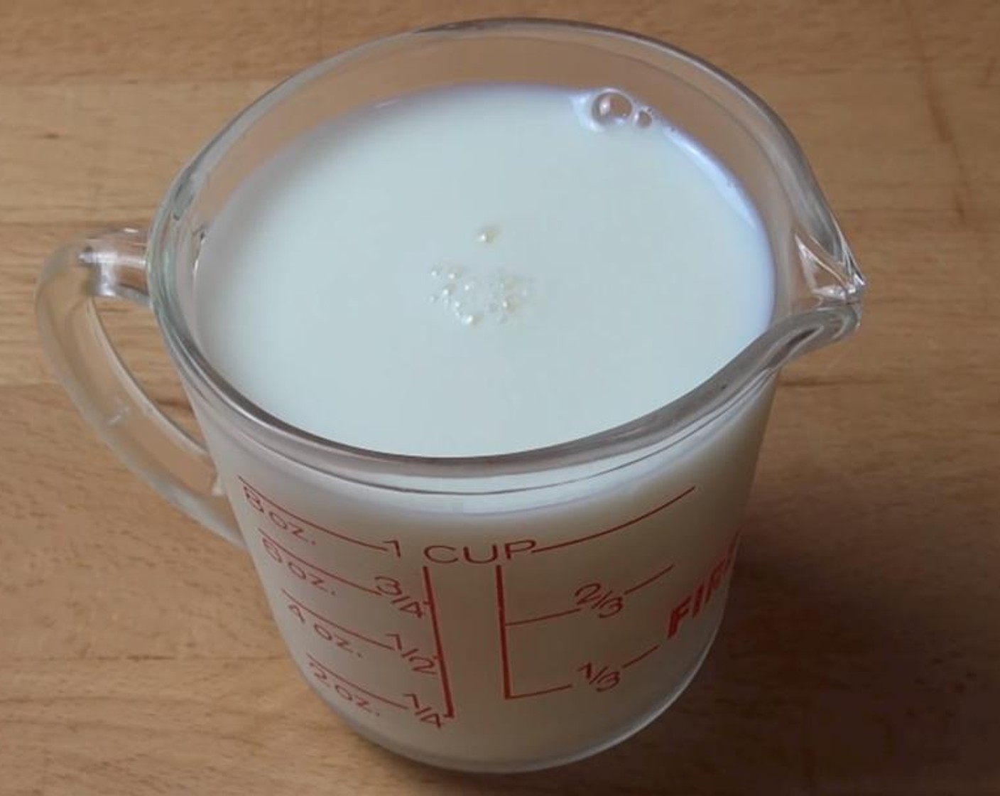 step 1 Put the Distilled White Vinegar (1 Tbsp) into the Milk (1 cup). Stir them together.