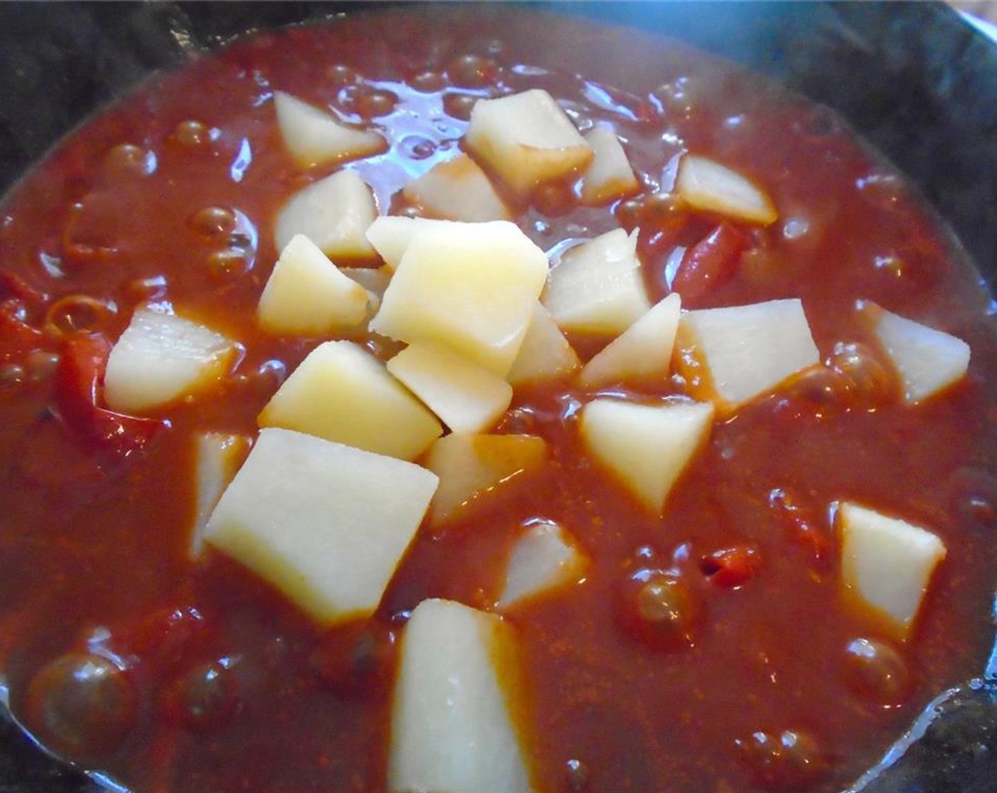 step 6 Add potatoes and simmer for 5 minutes.