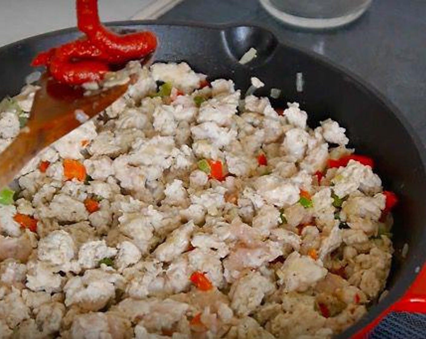 step 3 Once the veggies have started to soften add the mince chicken and cook stirring occasionally.