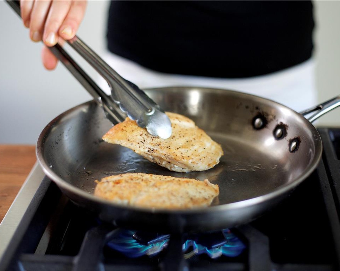step 5 Heat a medium saute pan over medium high heat and add Olive Oil (1 Tbsp). Pat dry Chicken Breasts (2) with paper towels and season each breast with Salt (1/4 tsp) and Ground Black Pepper (1/4 tsp).