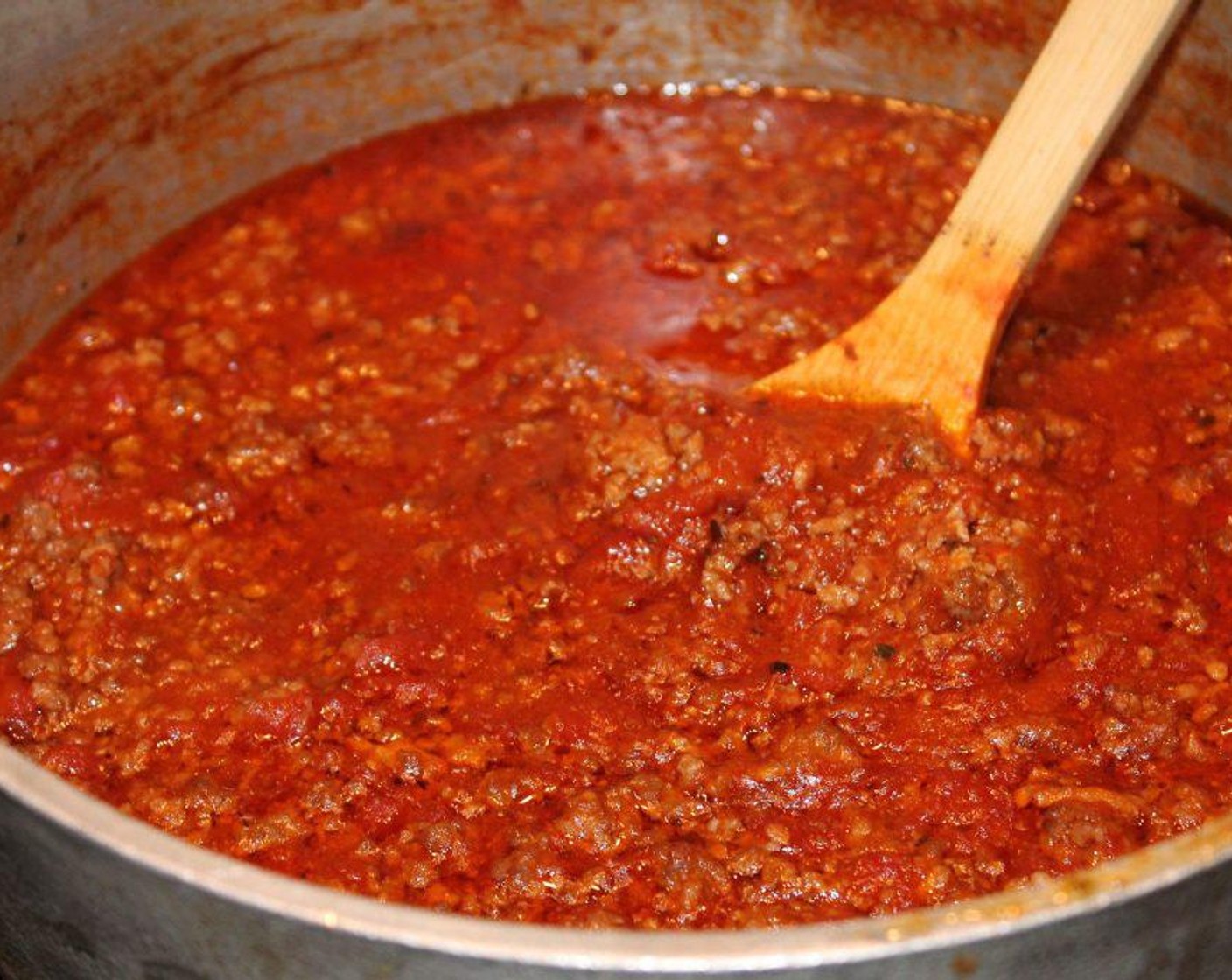 step 5 Add in Tomato Paste (3 Tbsp) with a dash of Salt (to taste) and Ground Black Pepper (to taste). Slowly bring to a boil, then lower heat to a low heat and cook for 45 minutes stirring occasionally.