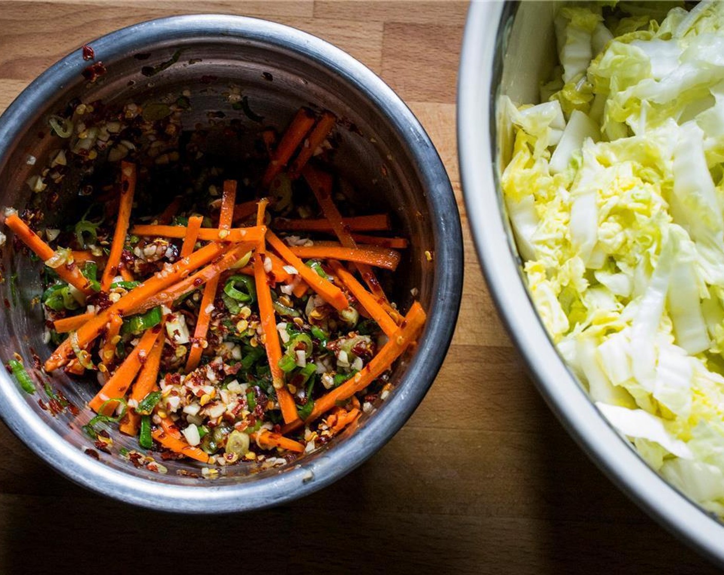 step 3 Combine Crushed Red Pepper Flakes (2 Tbsp), Granulated Sugar (1 Tbsp), Fish Sauce (1/4 cup), Garlic (1/2 bulb), Fresh Ginger (1 Tbsp), Scallion (1 bunch), Carrots (2) a smaller bowl to make a paste.